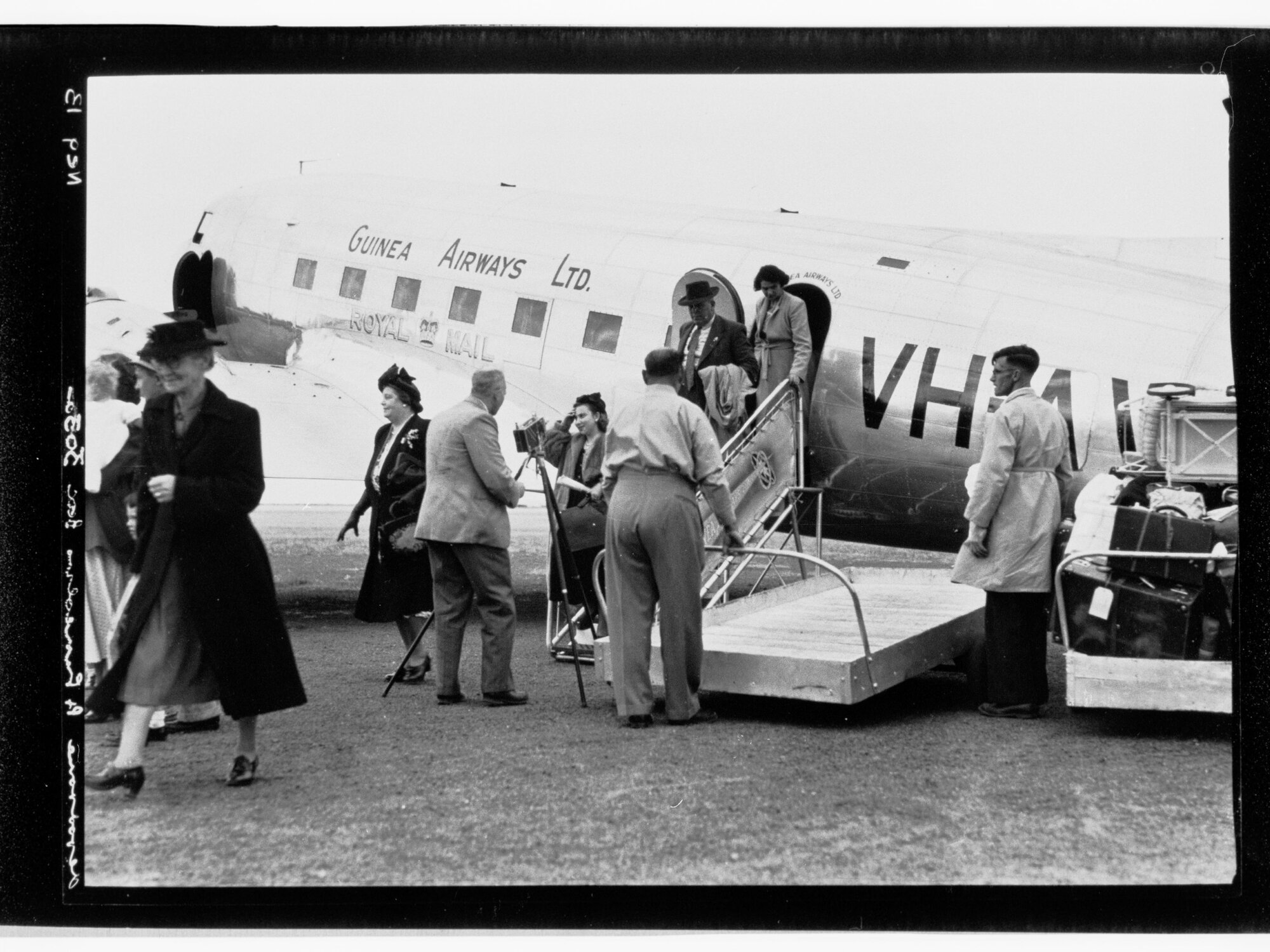 People disembarking from Guinea Airways Ltd (VH ?)