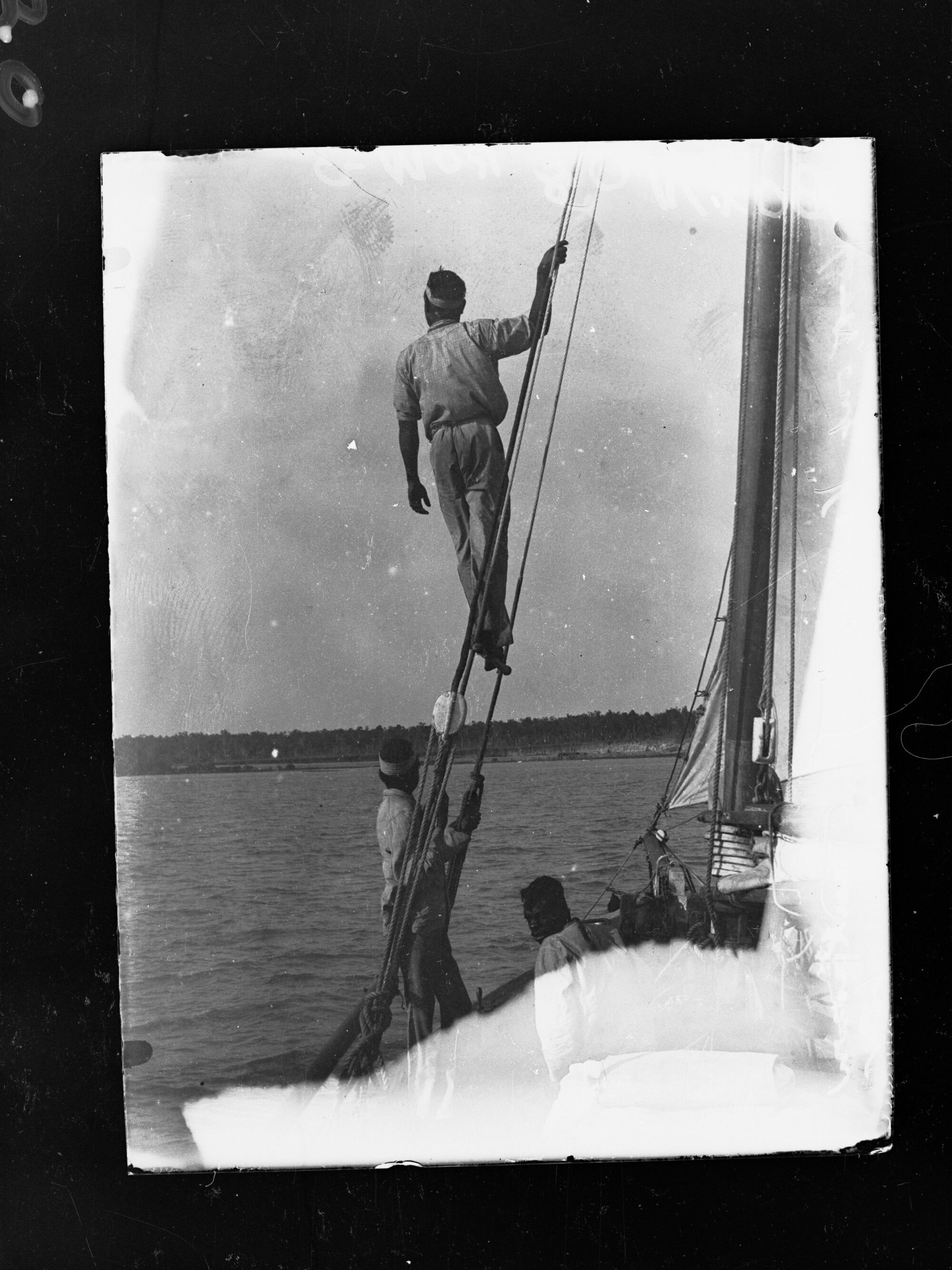 Sailing ship Venture,  sailor on lookout in unknown bay.  