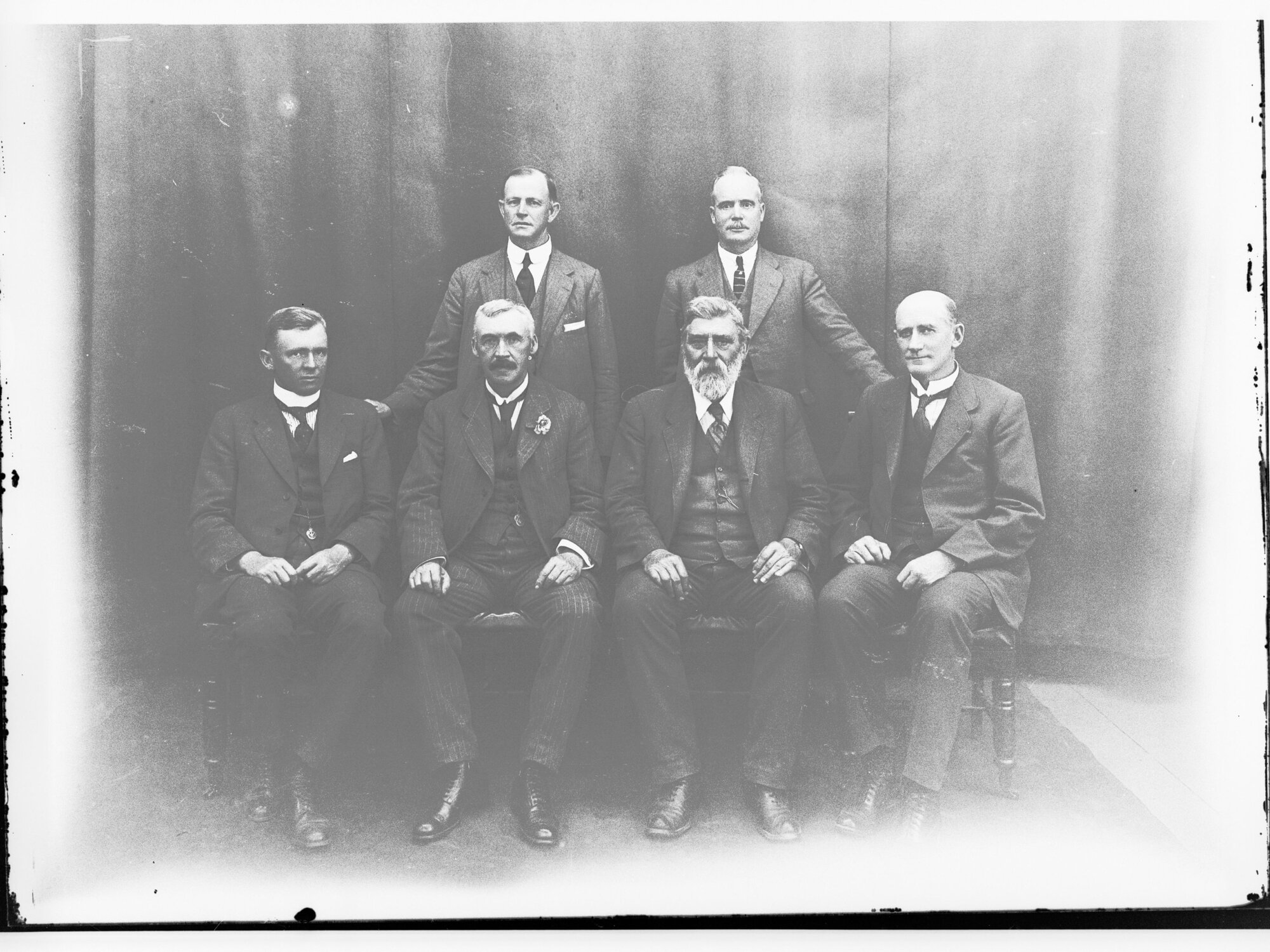 Group photograph of Peake  Ministry - (Standing W.H. Henry, E.A.Anstey.  Sitting H.N. Barwell, A.H. Peake, J.G. Bice, G. Ritchie)