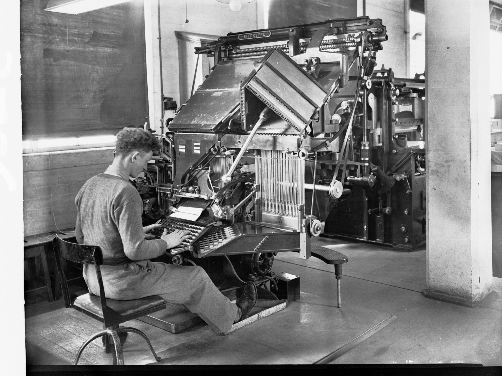 Student Working Type-Setting Machine at Printers Trade School