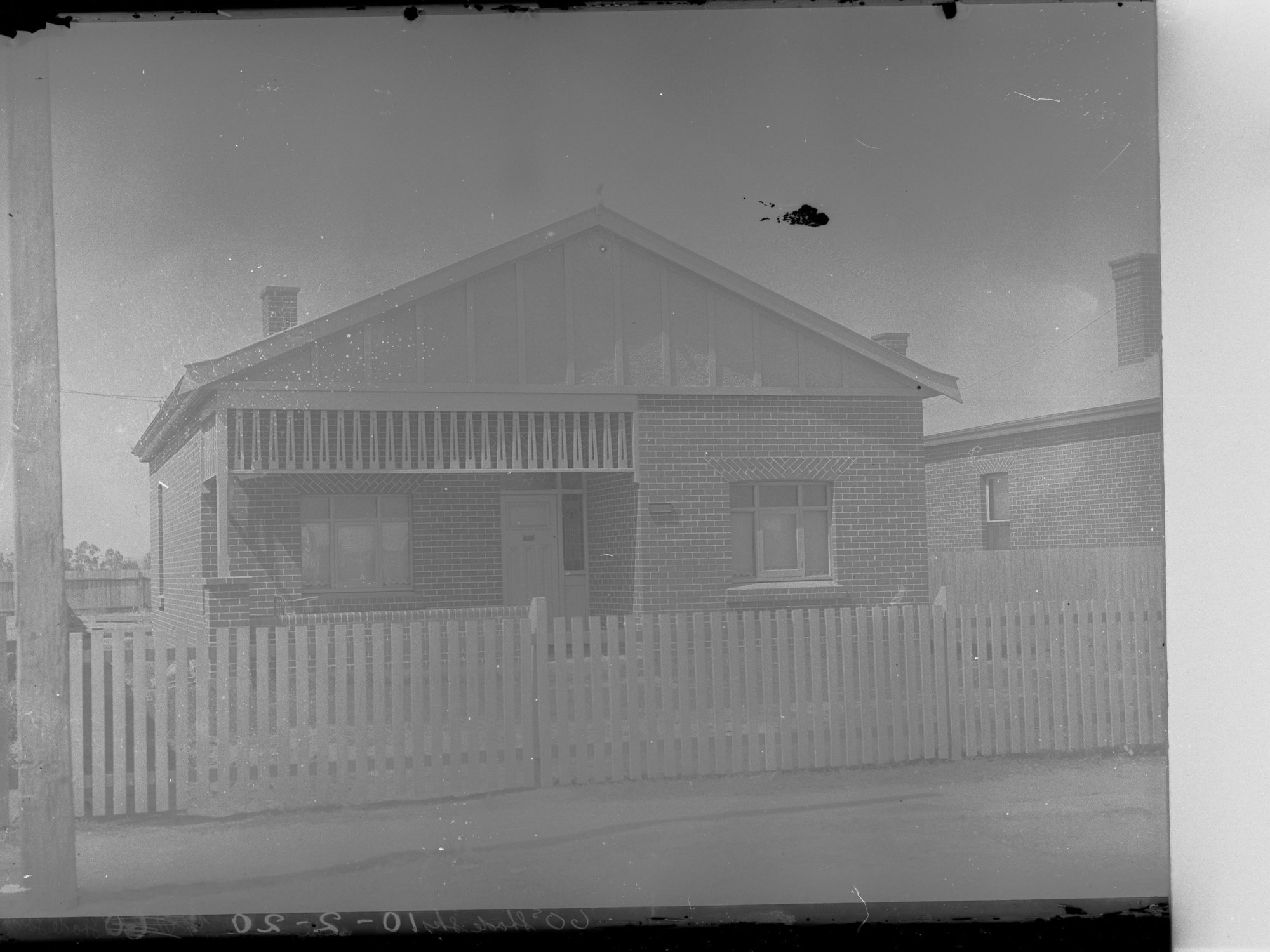 A Soldiers' Home, South Australia, with a picket fence in the foreground