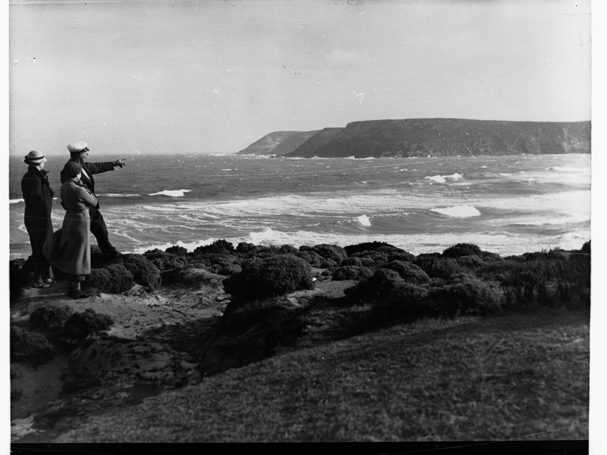 Coastal views showing people standing on rocks