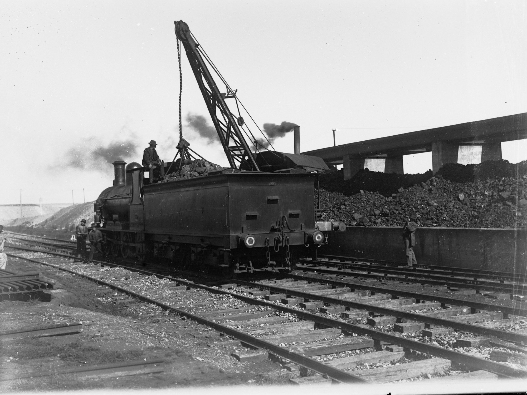 Loading coal onto a locomotive tender at Mile End - Railway Commissioner's Report