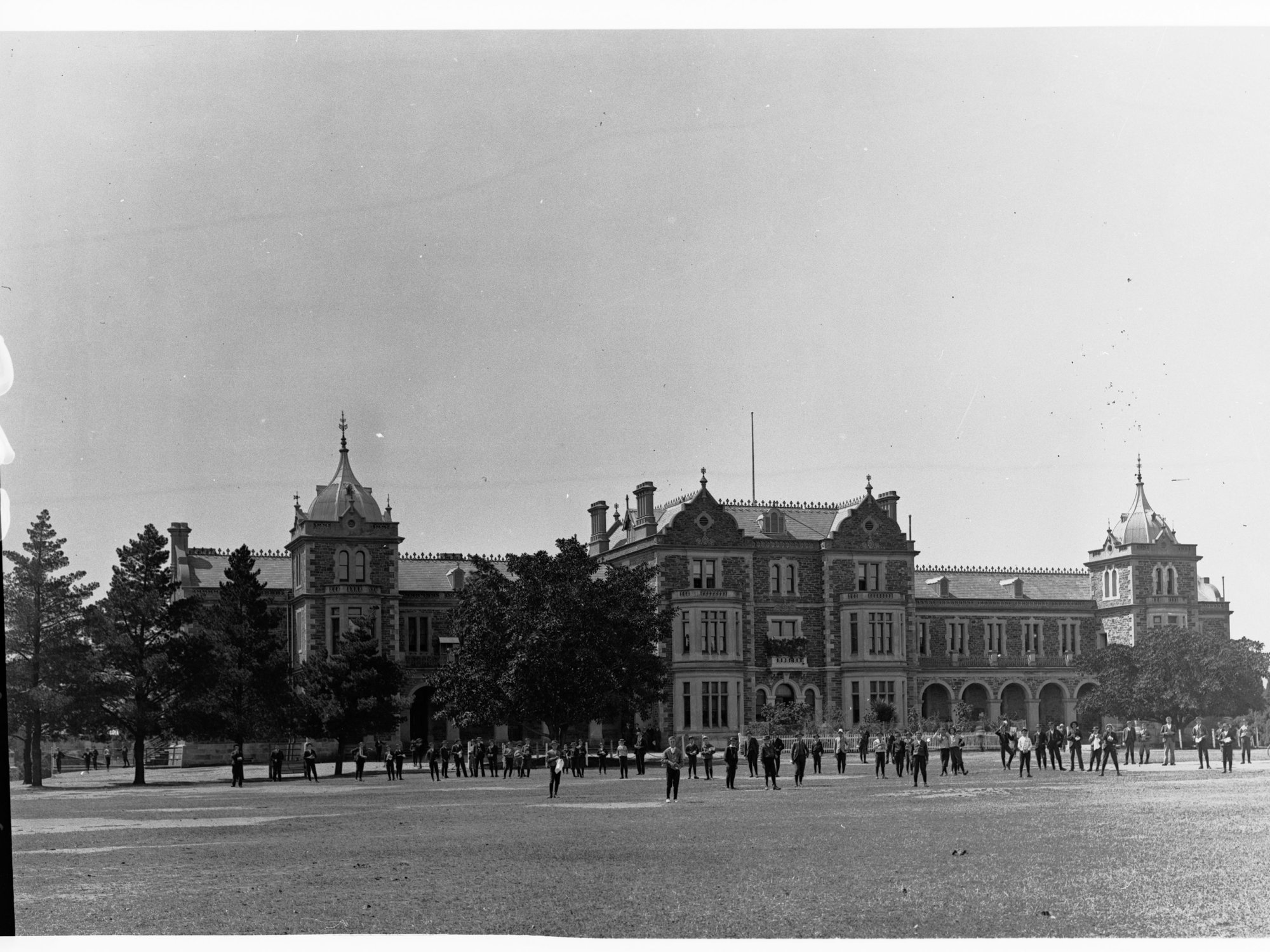 Prince Alfred College - shows students on field outside building