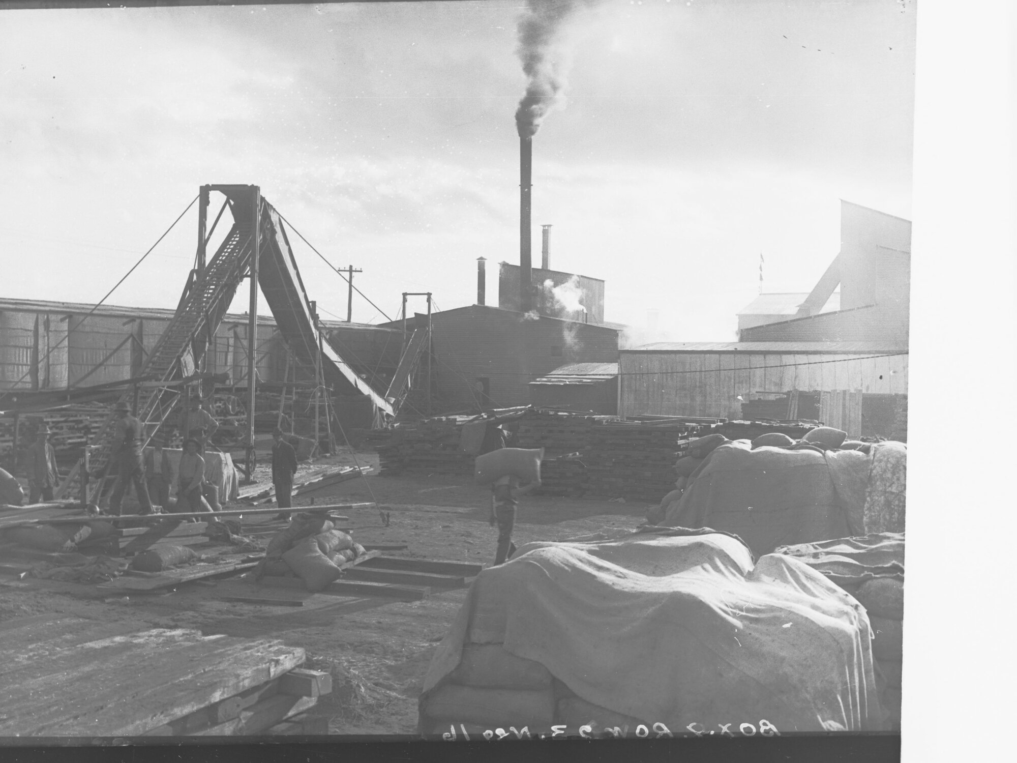 Men loading wheat sacks at Flour Mill Port Adelaide
