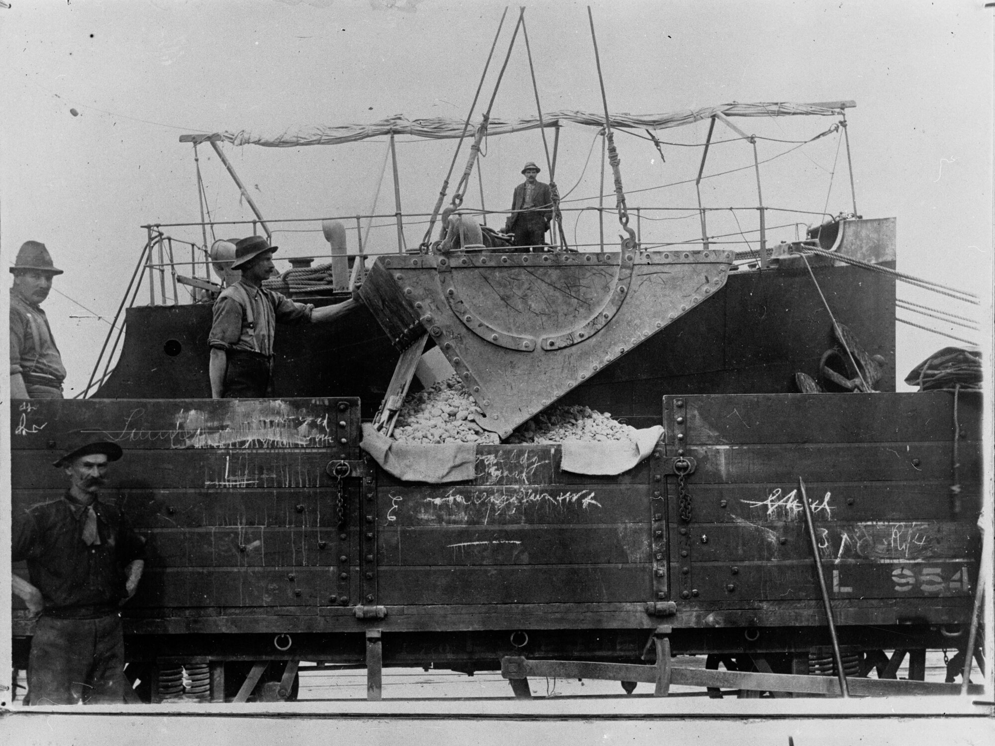 Men working on a wharf - Harbours Board Report