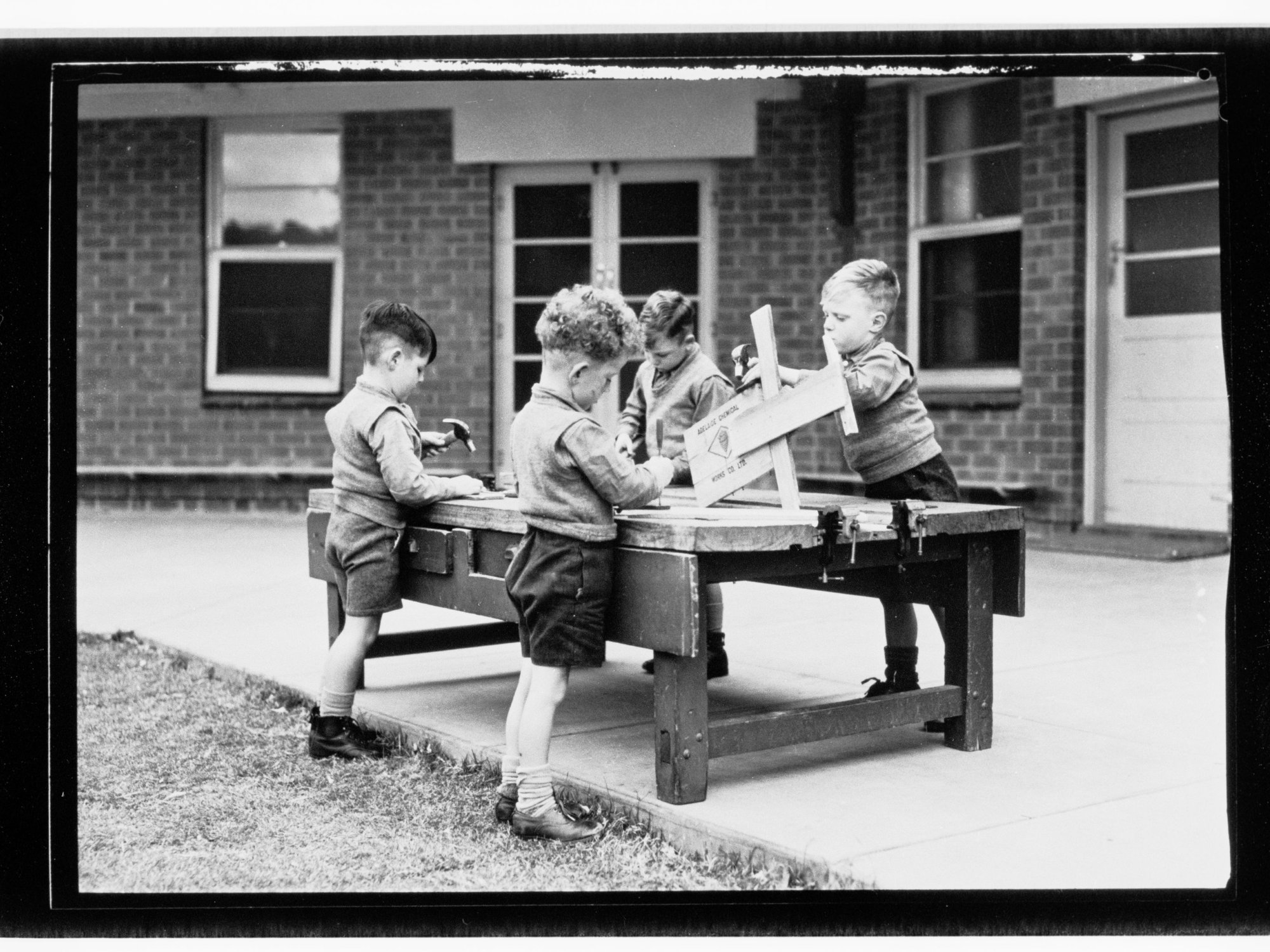 Child Welfare Department,  four small boys doing  woodwork