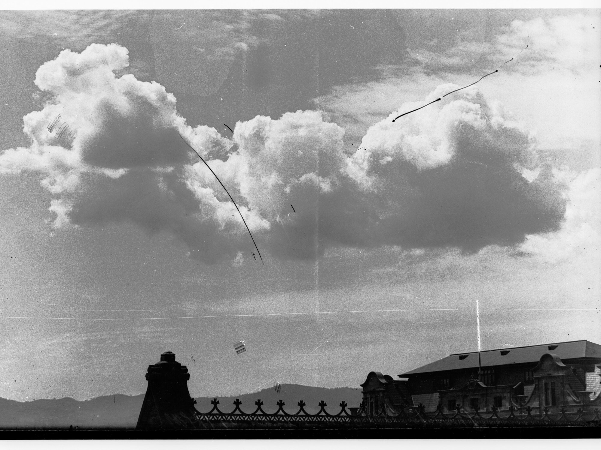 Clouds above rooftops - no information recorded