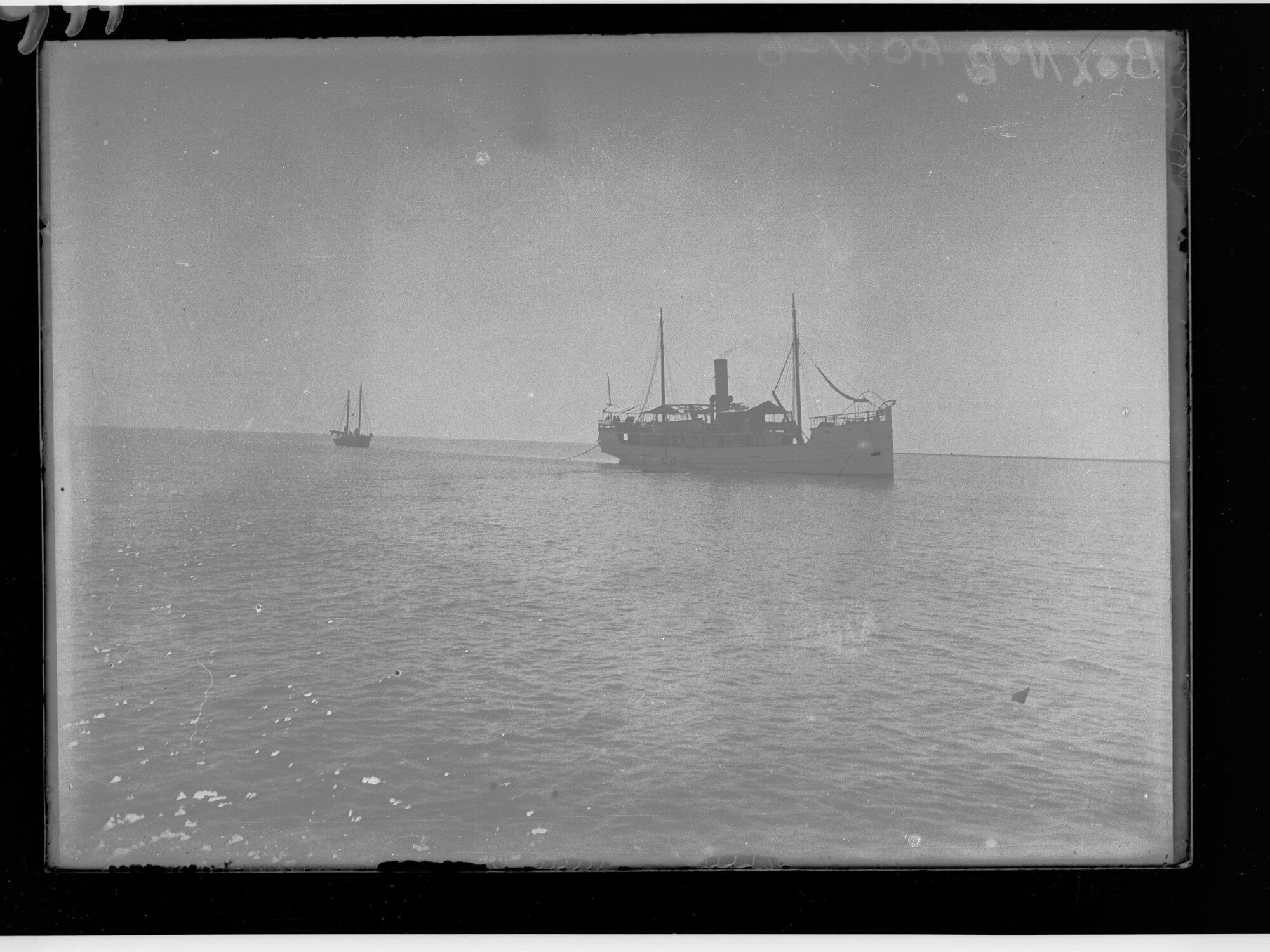 Picture of a ship and another boat in background 