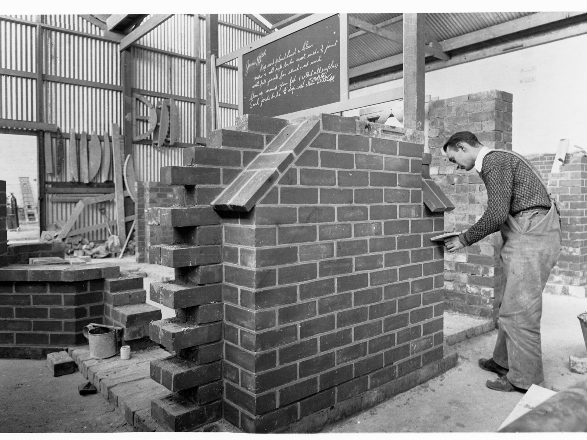 Education Department Trade School showing a student doing brickwork