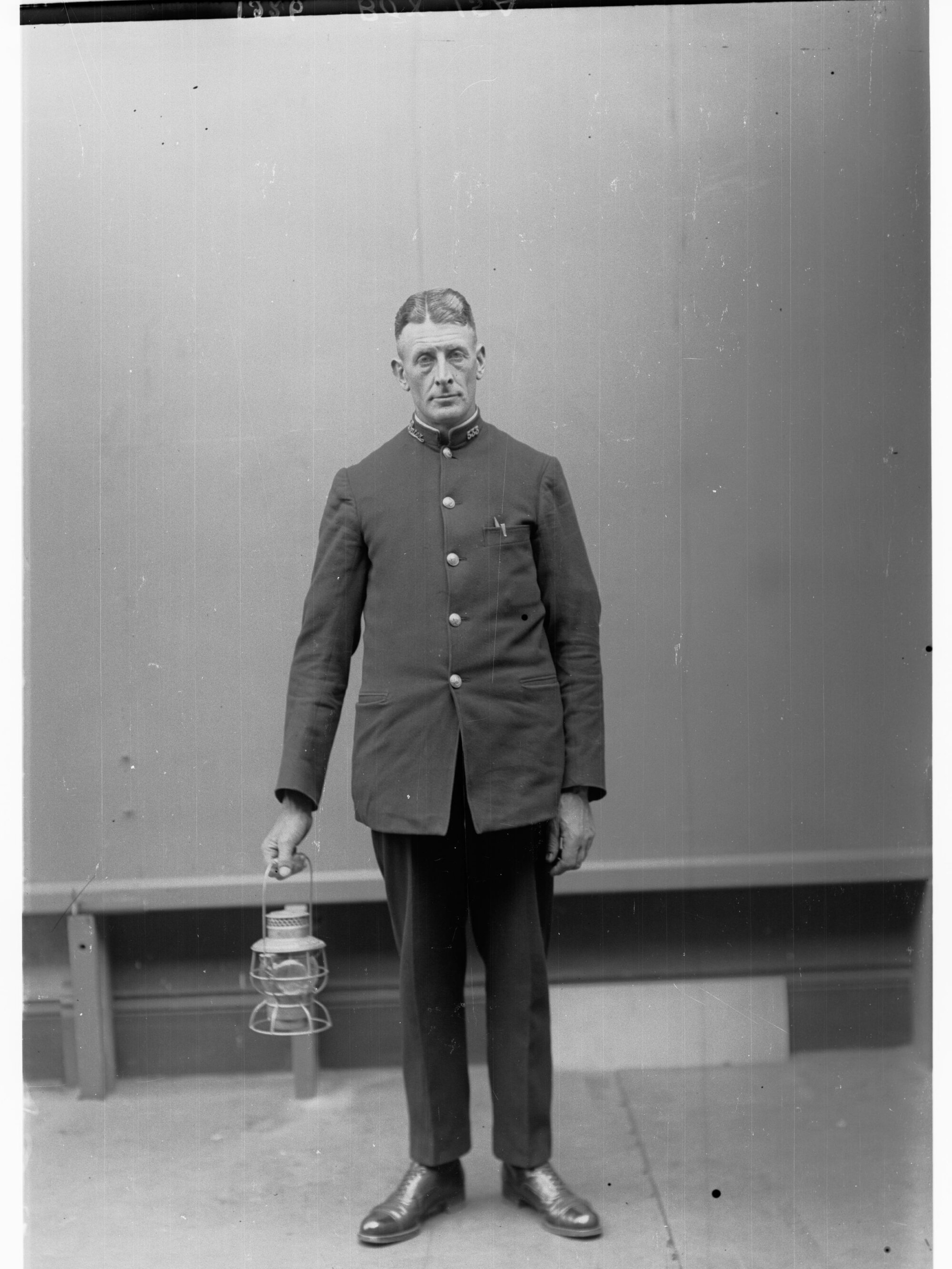 Porter demonstrating railway lantern signals