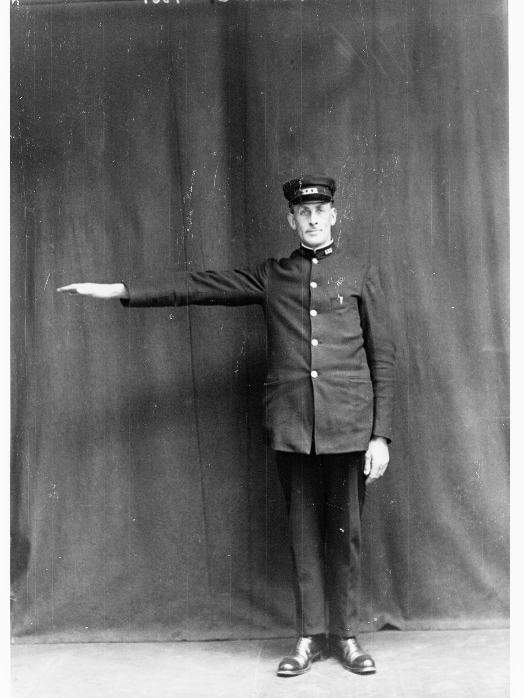 Porter demonstrating railway hand signals