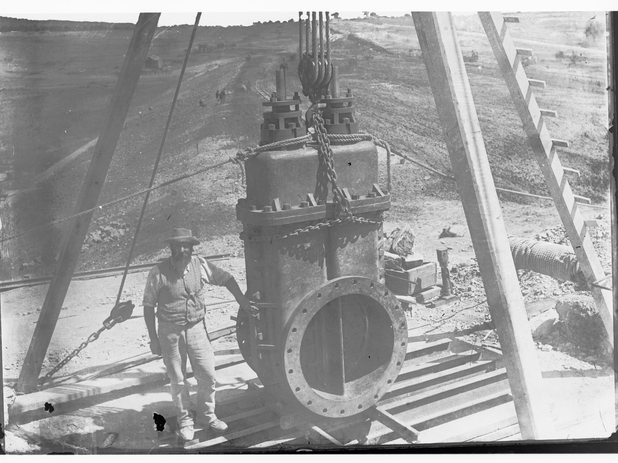 Happy Valley Waterworks - man standing next to piece of equipment