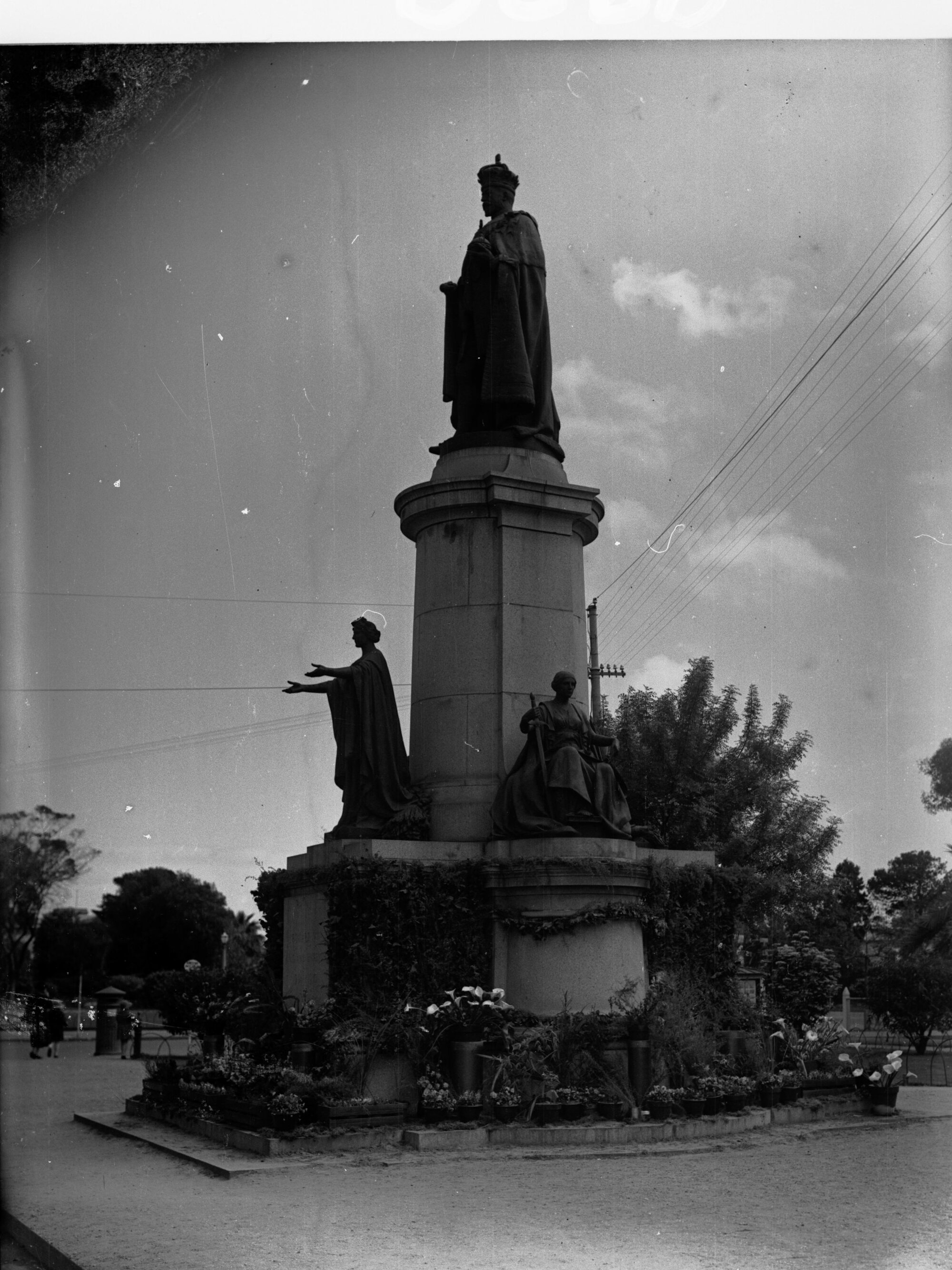 Statue of George V decorated with flowers for Adelaide centenary