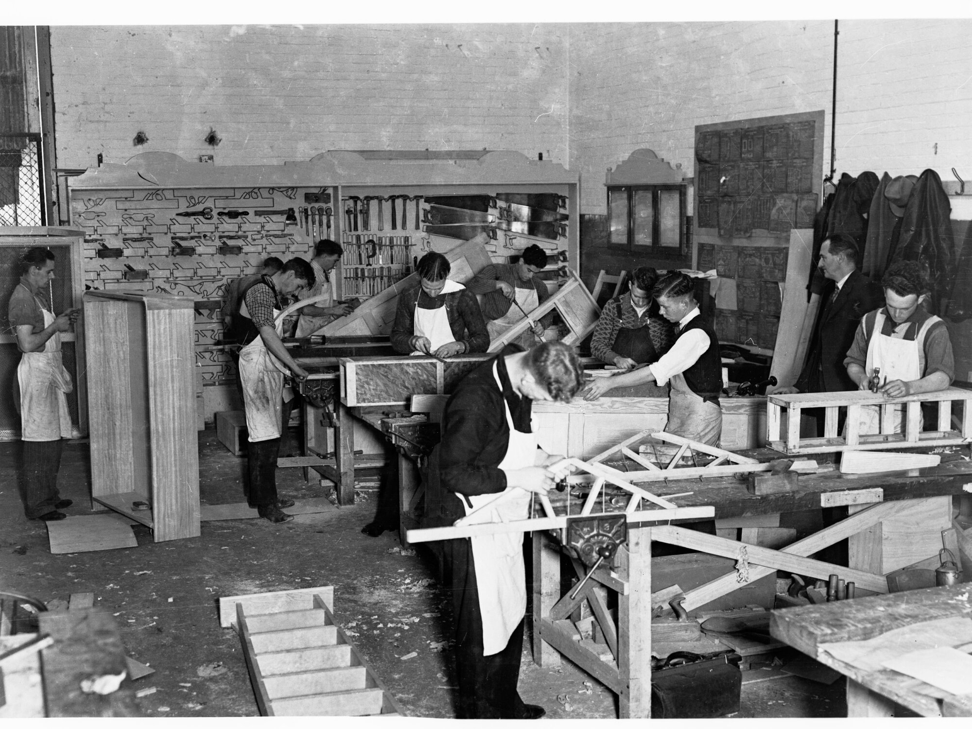 Education Department Trade School showing students doing woodwork