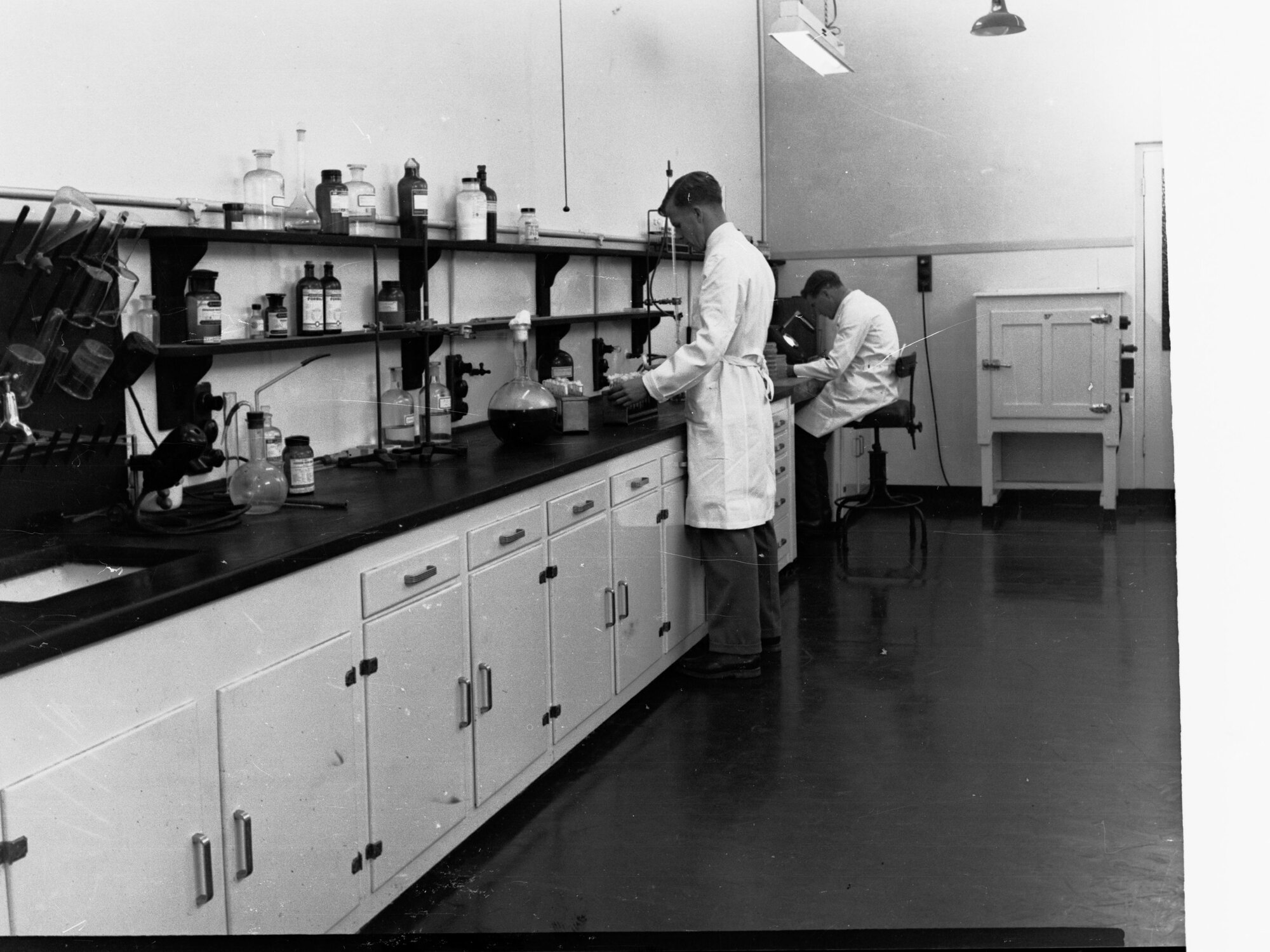 Engineering and water supply, men working in laboratory - Glenelg Sewerage Treatment Works