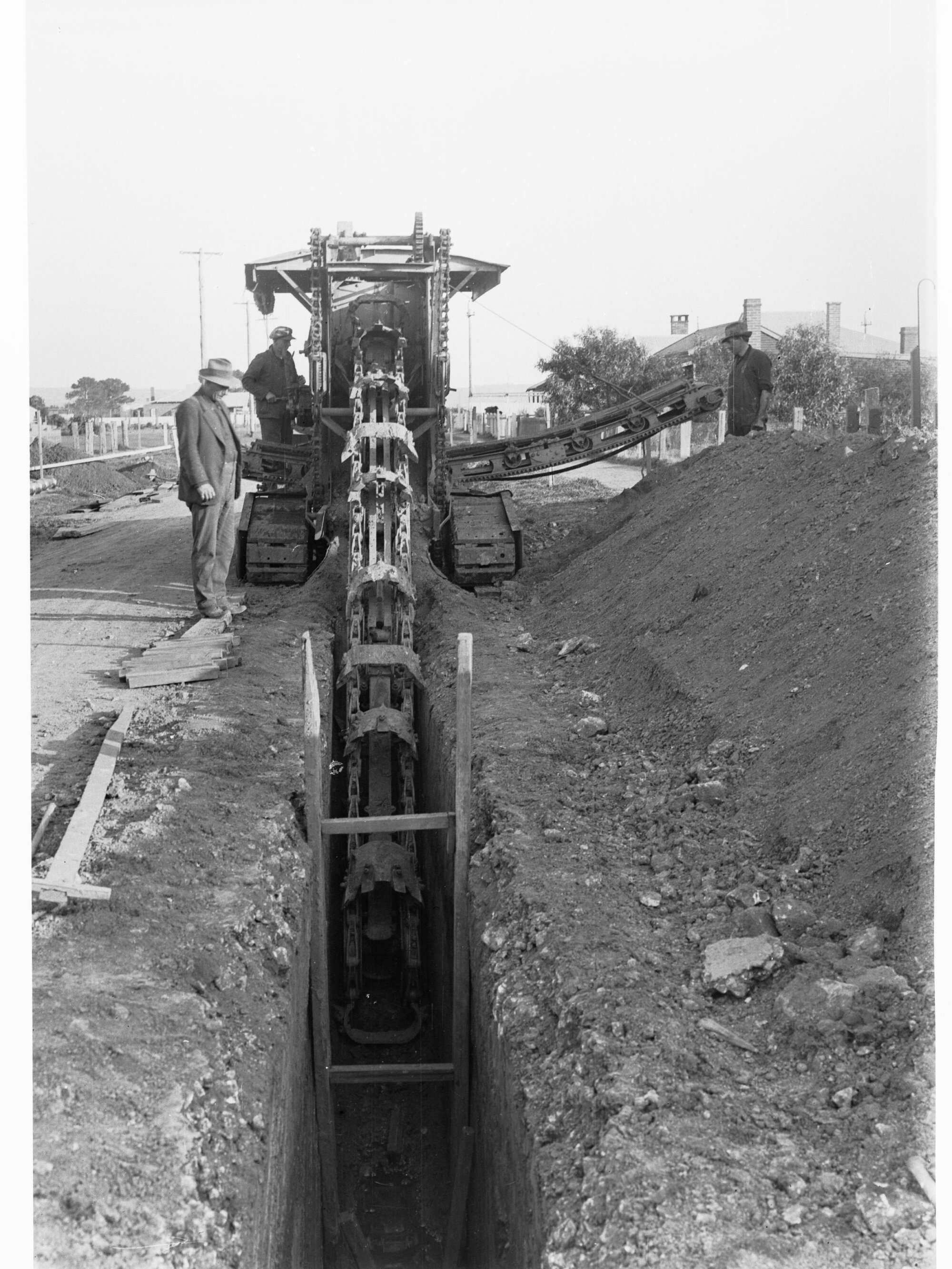Glenelg Sewers showing machine digging a ditch