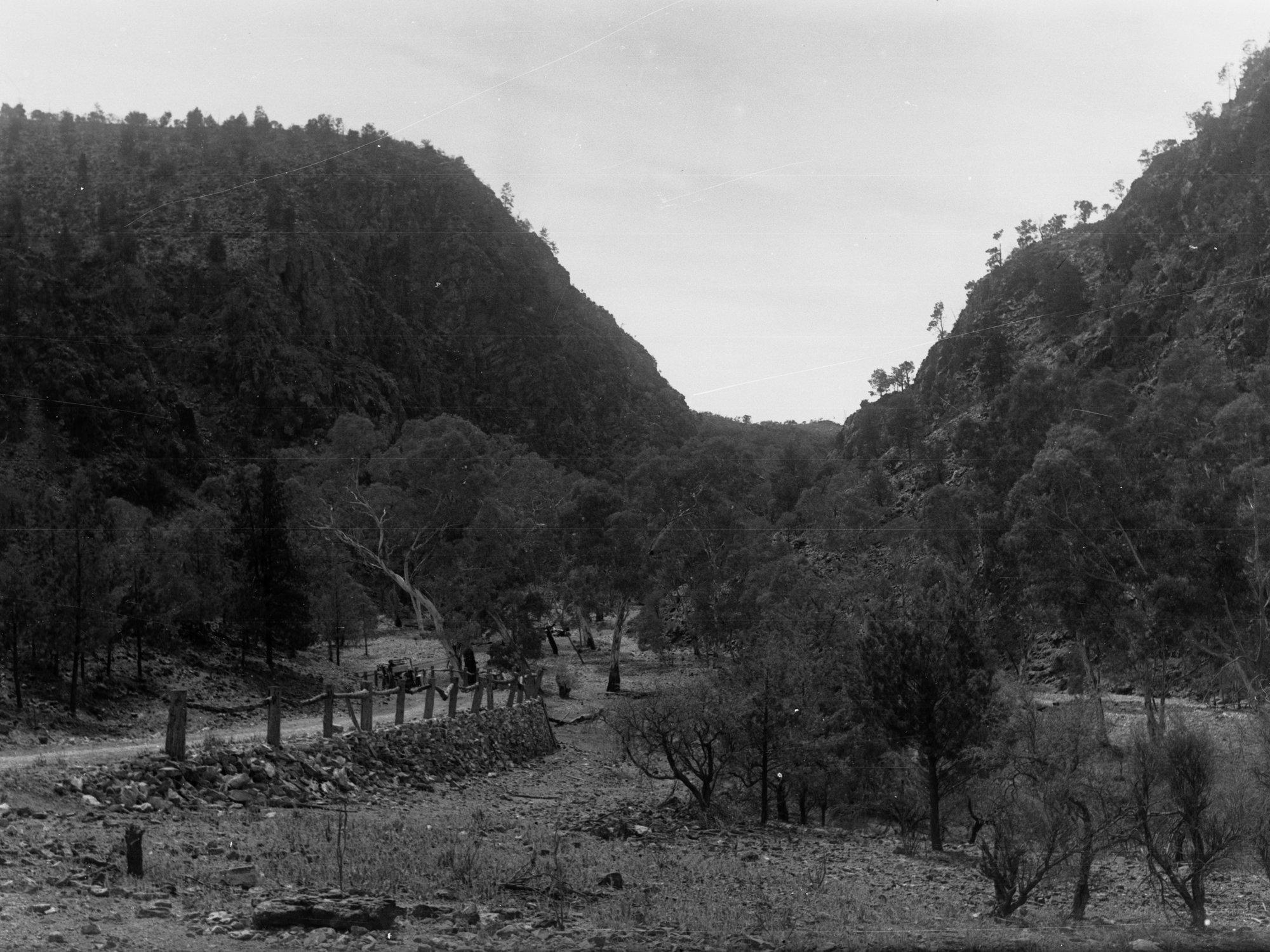 Rural View showing fencing and automobile on the road