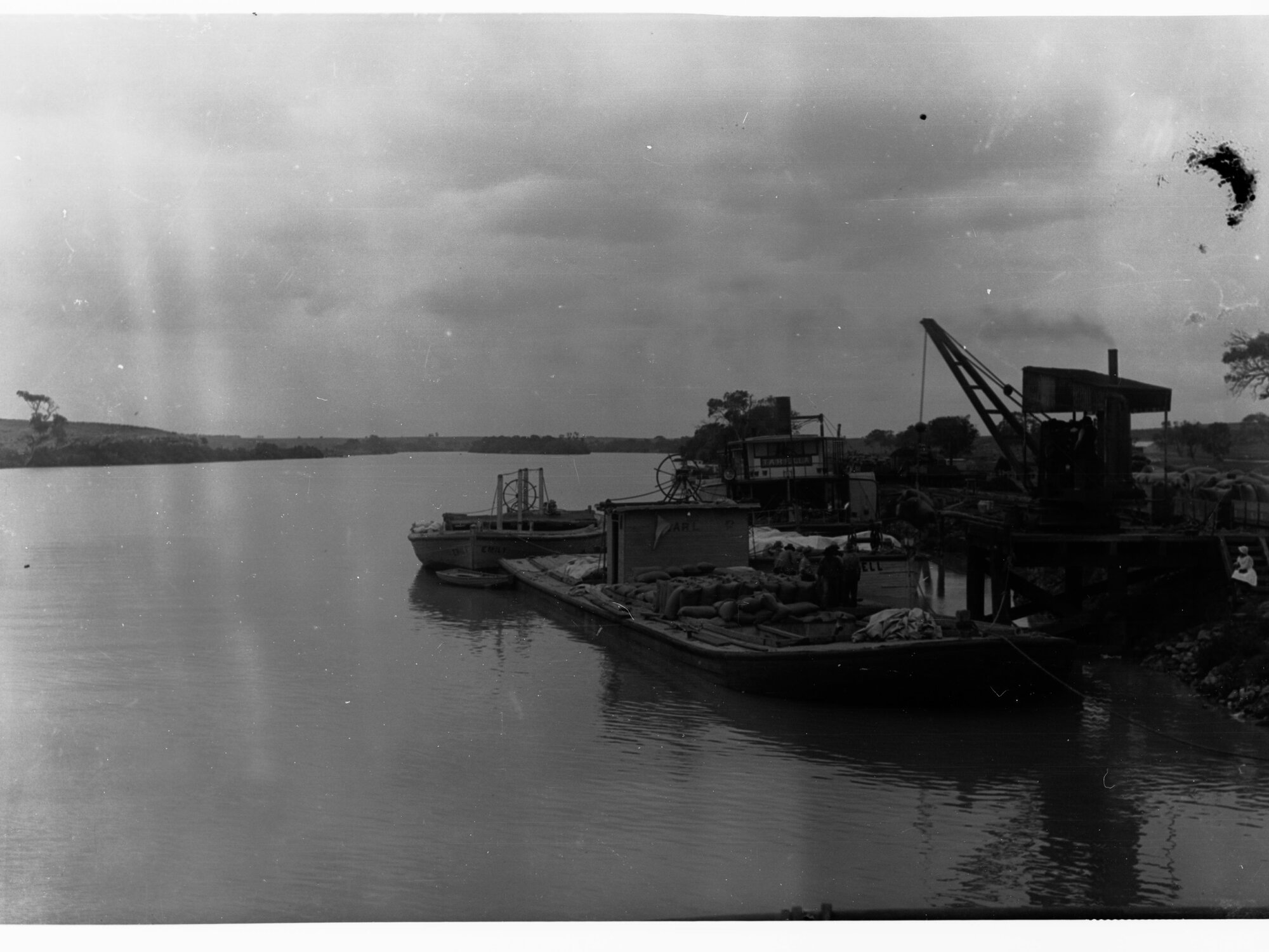 Boats on River Murray Bank, boats loaded with sacks and goods