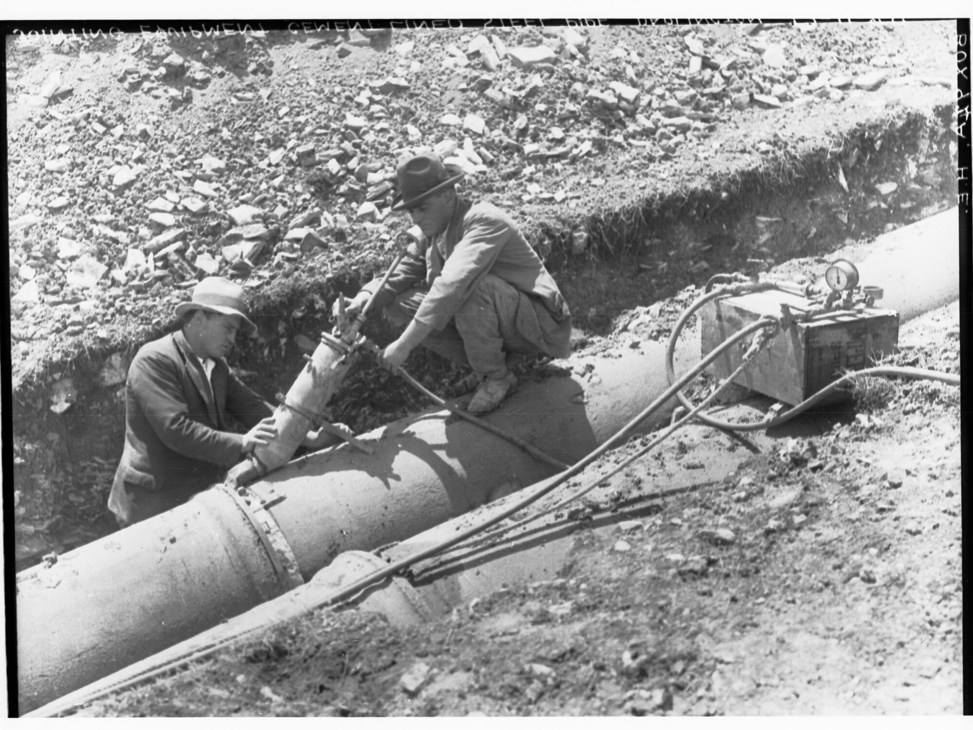 Men fixing pipeline, Darlington