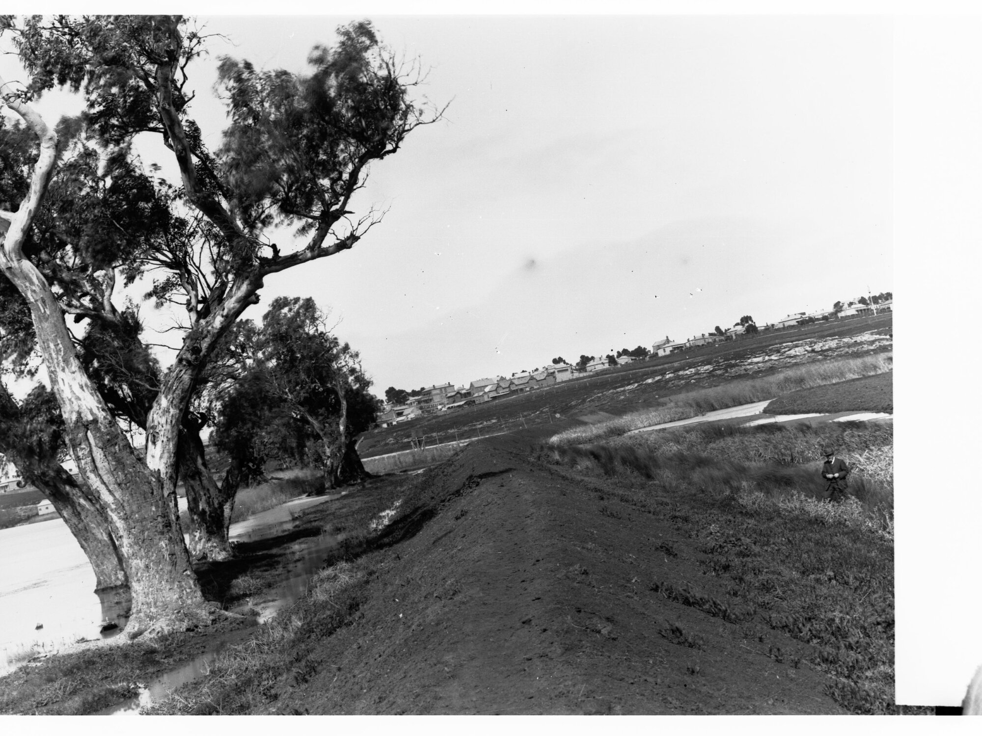 Mound of Dirt Next to River Murray Showing Town in the Distance