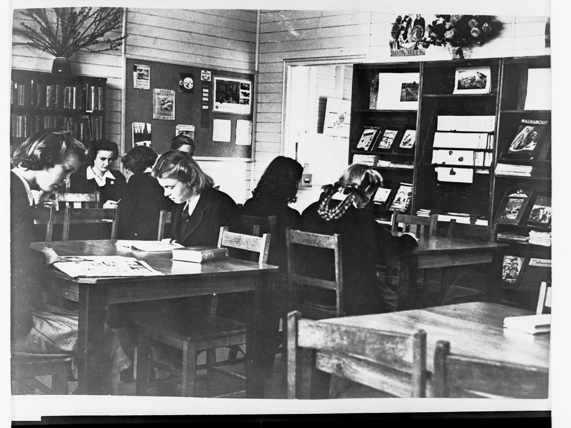 School Library Showing Girls at Tables Reading