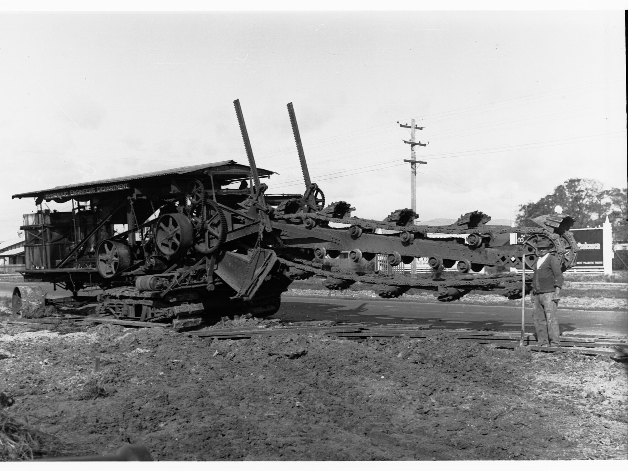 Earthmoving machinery digging ditches at Edwardstown for sewerage