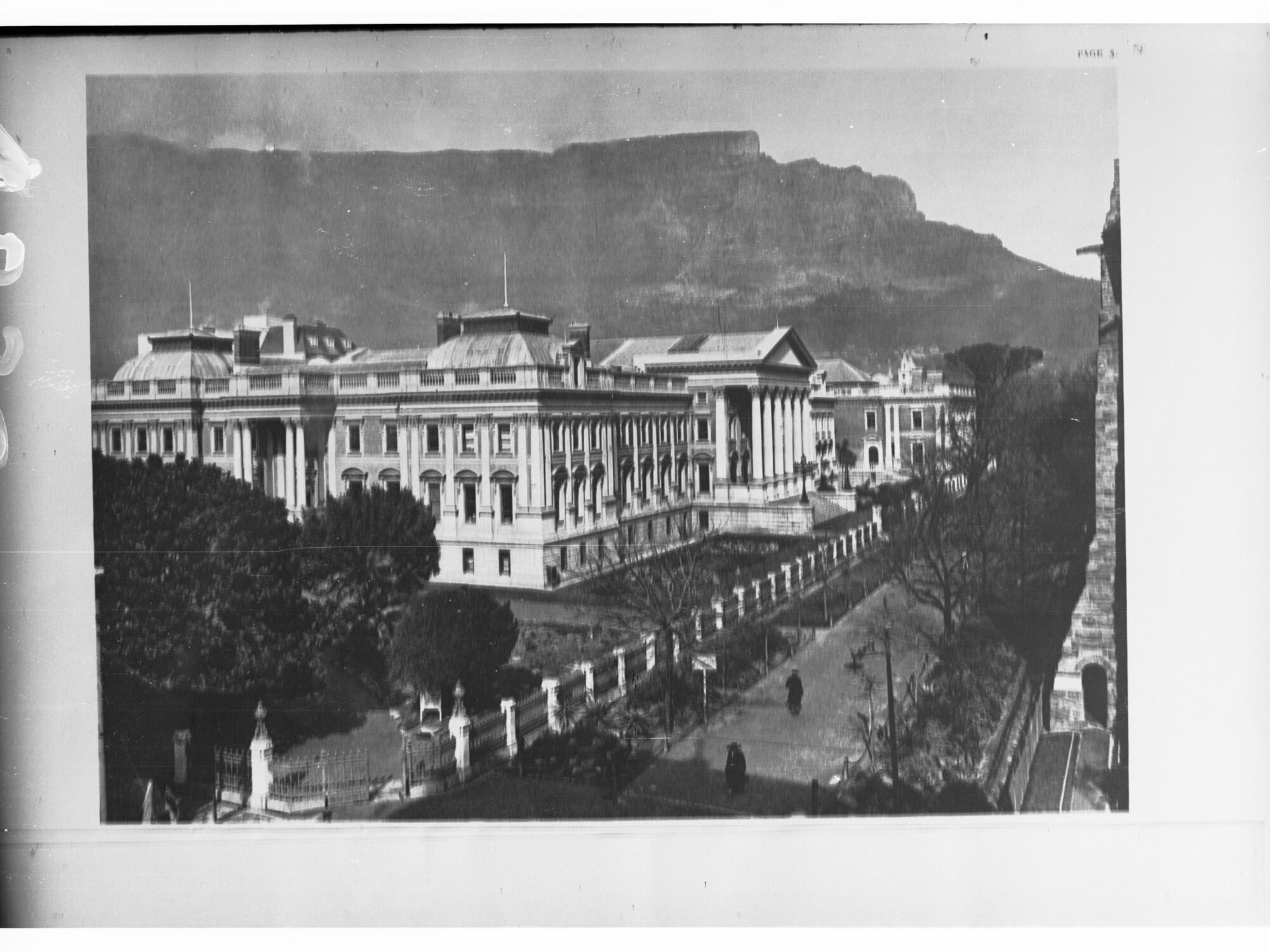 Cape Town Street Showing Buildings Footpath and Two People Walking Down the Street.