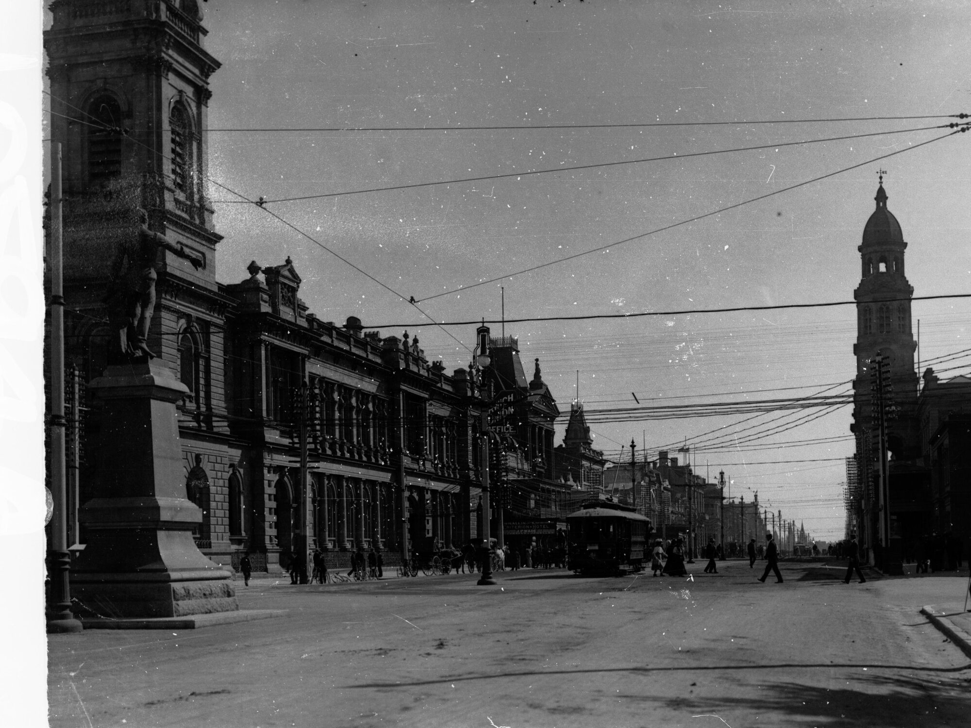 King William Street looking north from Victoria Square, includes statue of Colonel Light and trams