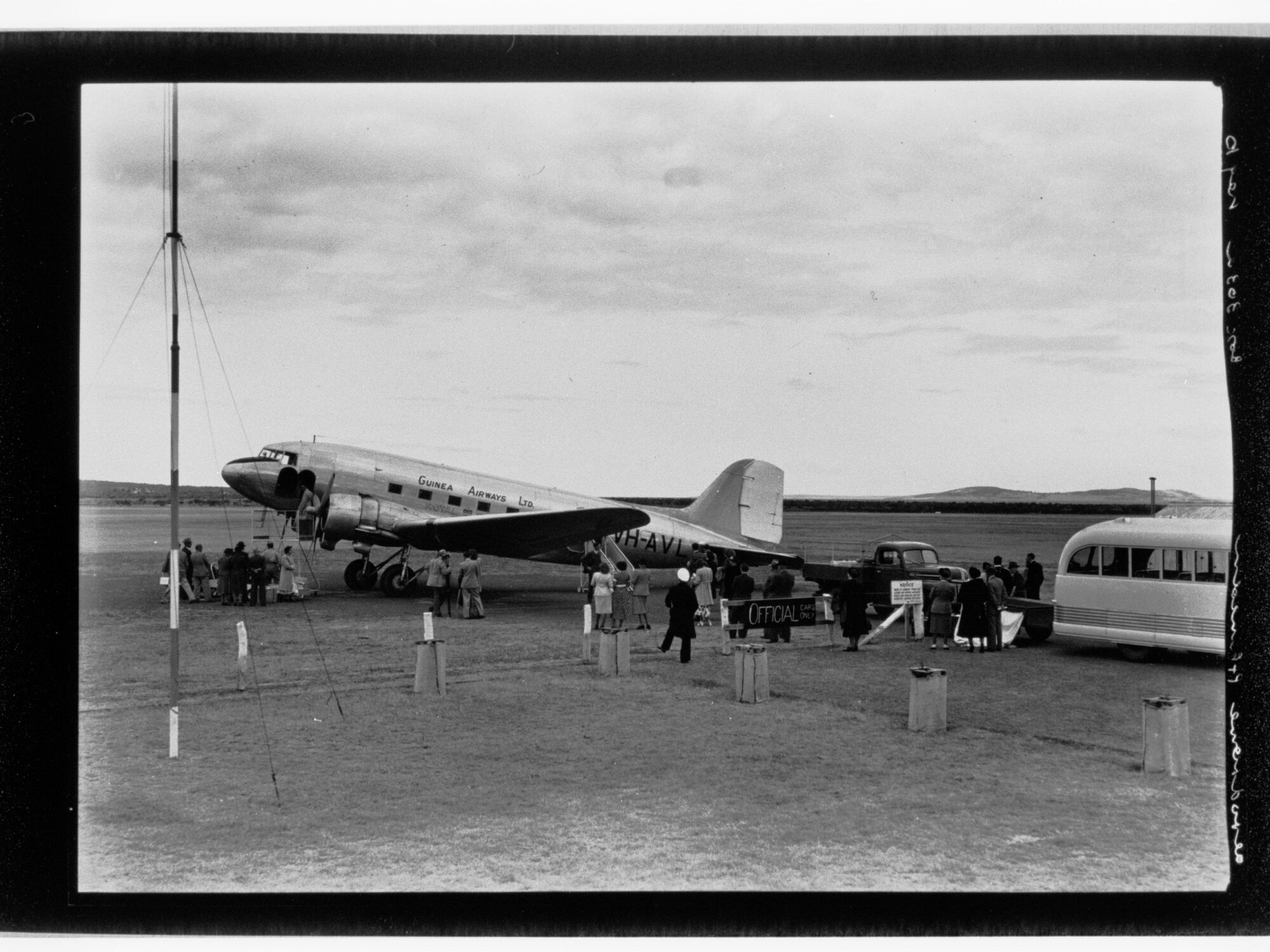 People standing around Guinea Airways Ltd plane