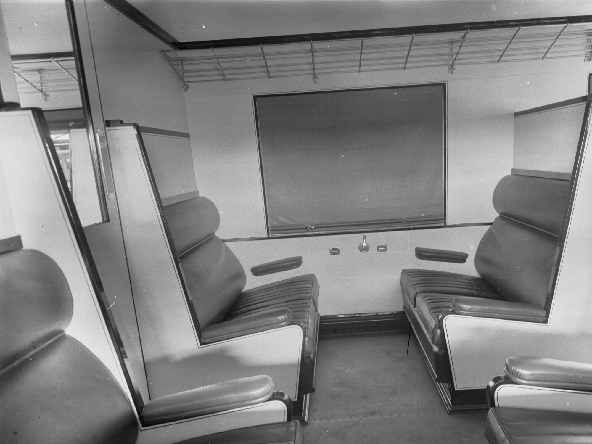 Railway carriage interior showing seats , number 55