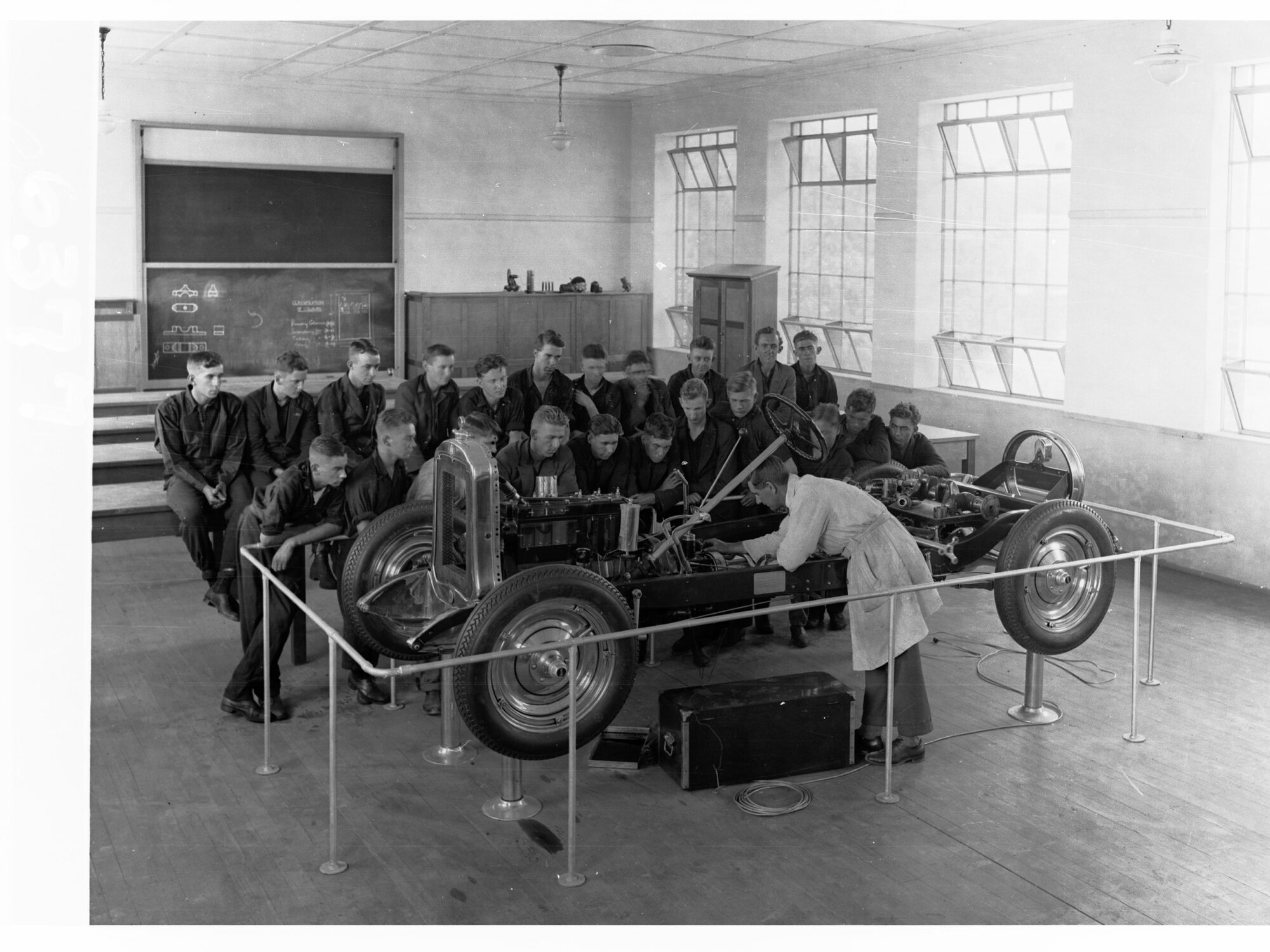 Technical College Showing Students Gathered Around an Automobile