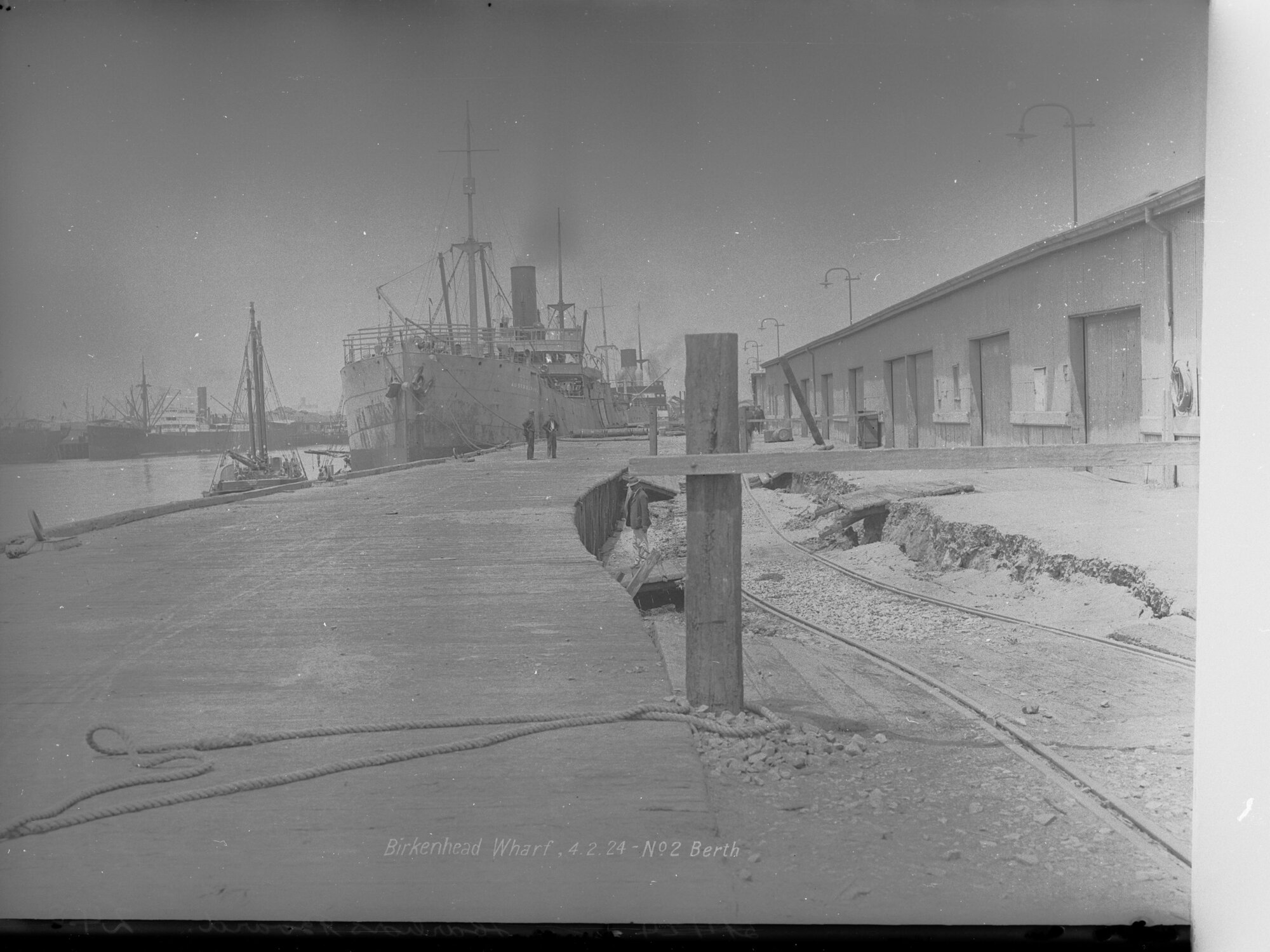 Birkenhead Wharf No. 2 Berth - shows steamship Australpool berthed at wharf and also shows subsidence in roadway