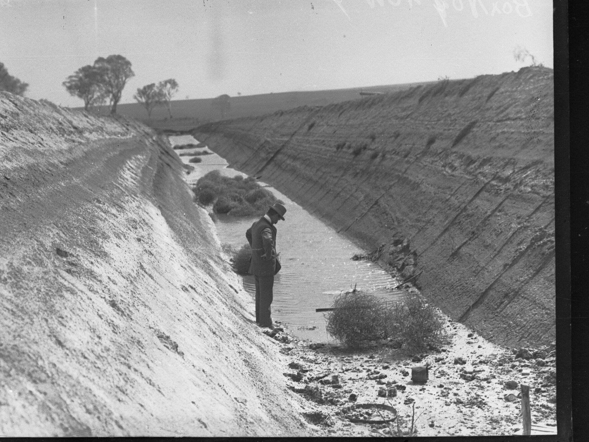 Director of Irrigation, Samuel McIntosh (Irrigation &amp; Reclamation Works Dept) examining newly dug drainage channel at Mypolonga.