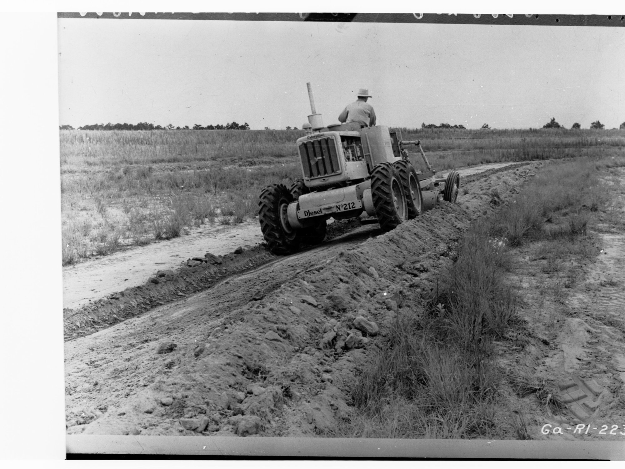 Man on harvesting machine