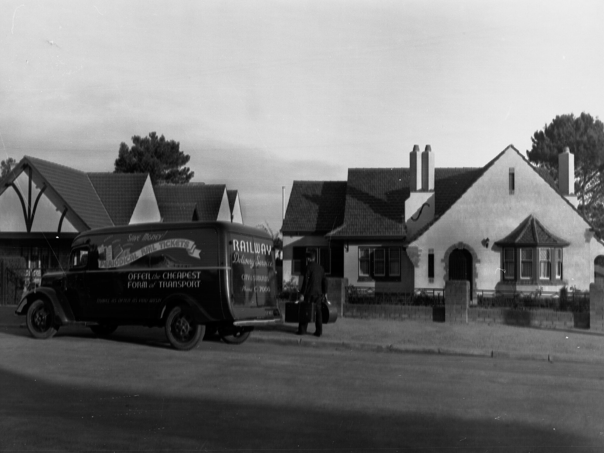 Railway Delivery Service Van Outside a House Man Carrying Suitcases