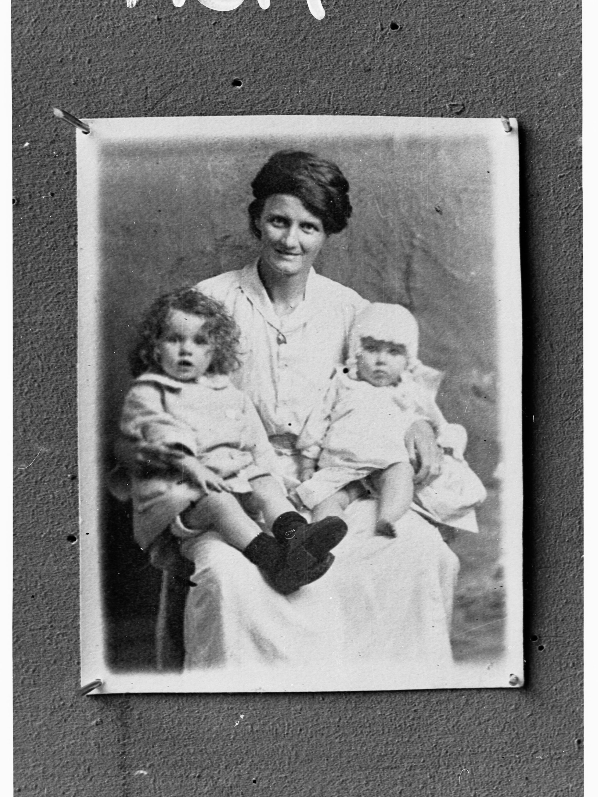 Portrait of unidentified woman with two children