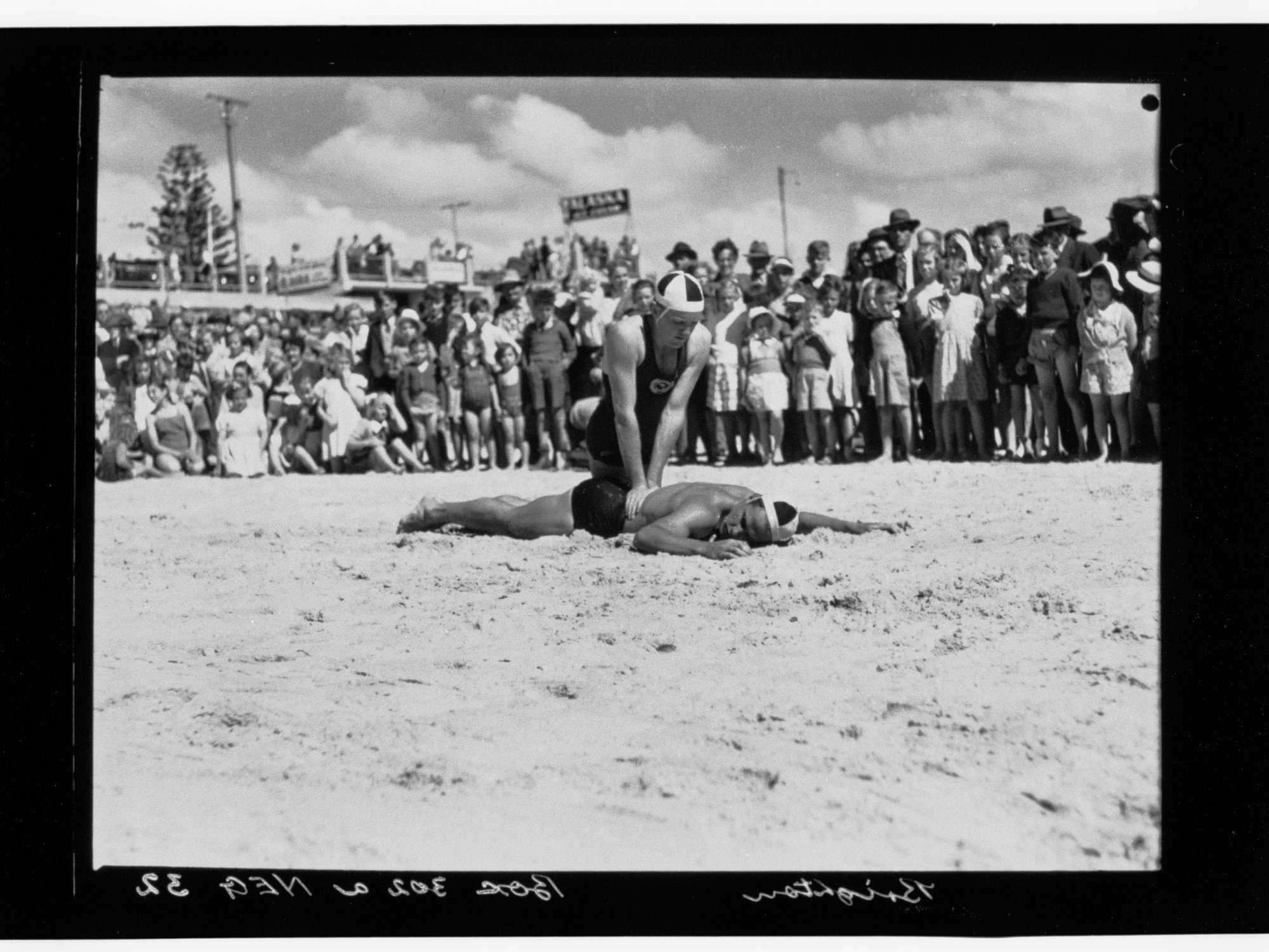 Brighton - group watching lifesaving demonstration