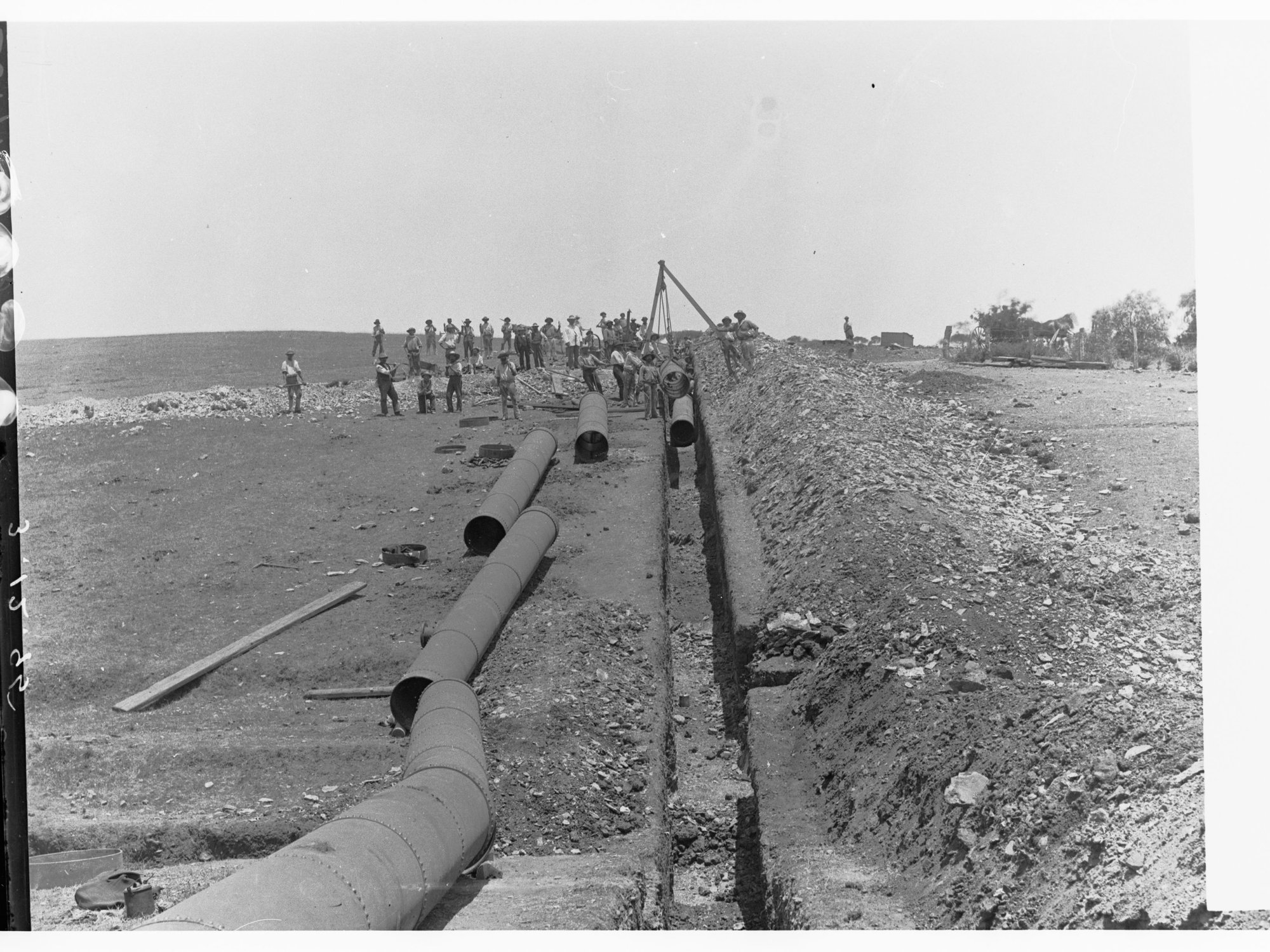 Happy Valley Waterworks - men laying pipes