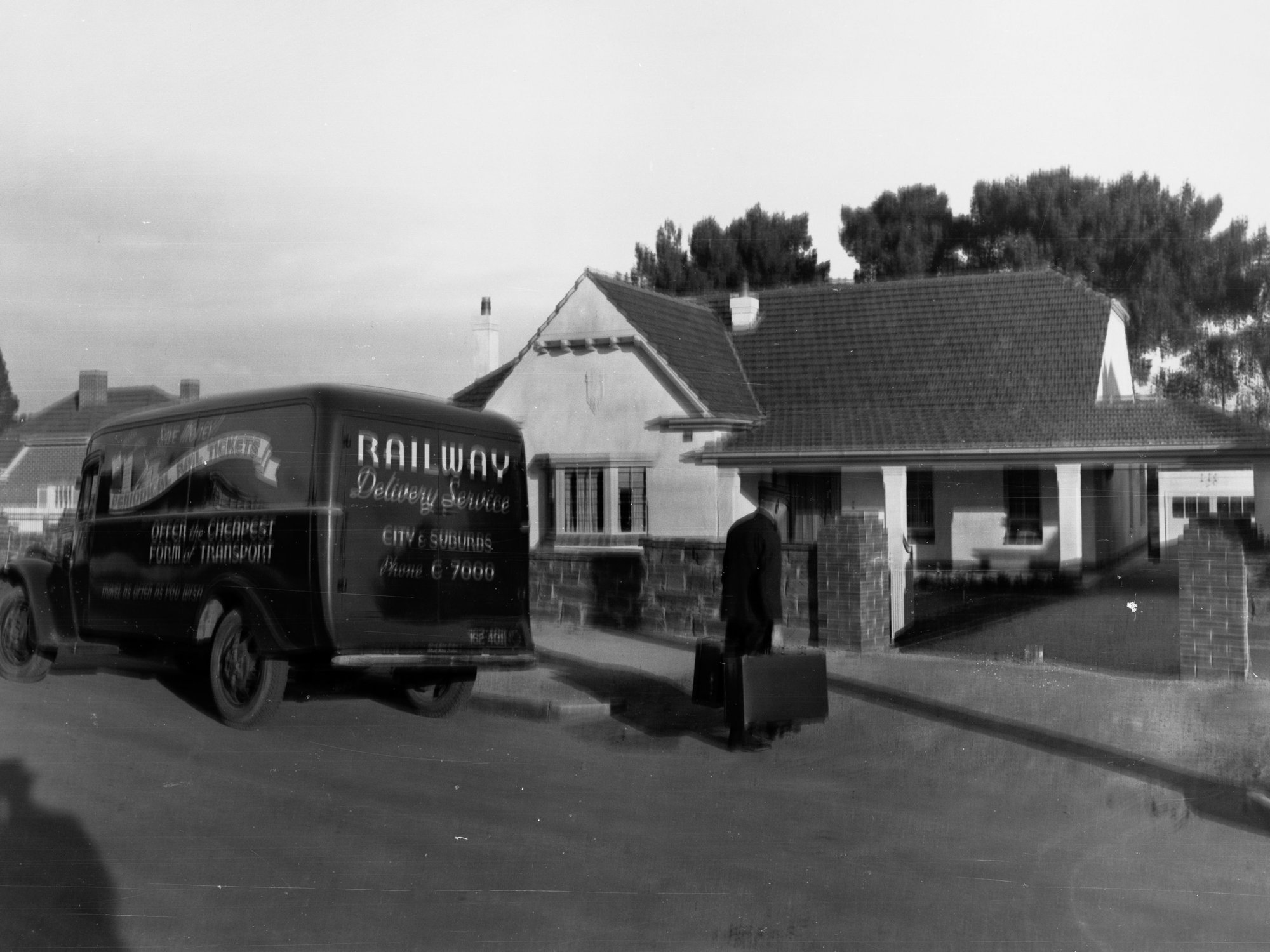 Railway Delivery Service Van Outside a House Man Carrying Suitcases