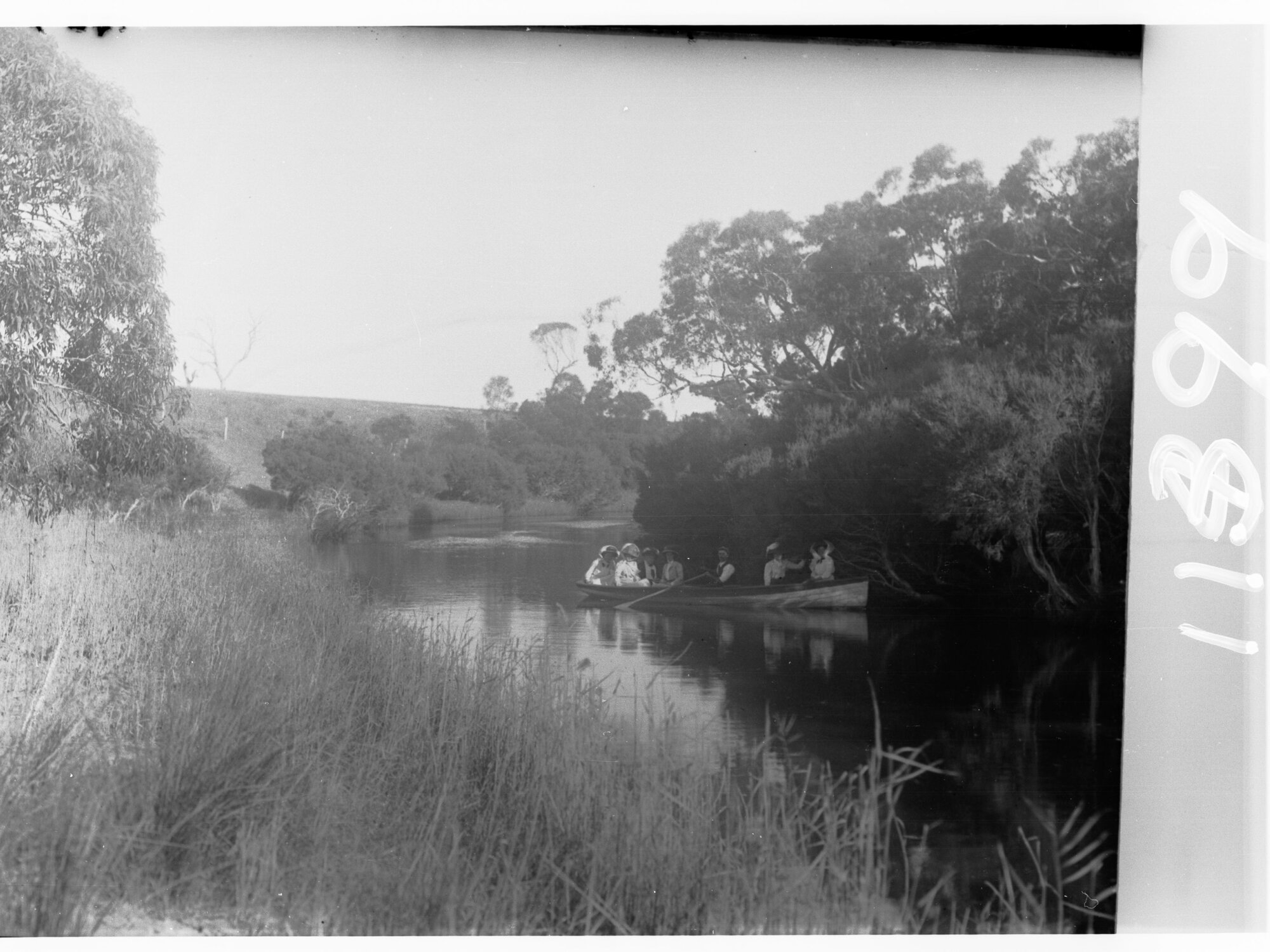 View on Hindmarsh River - Victor Harbor, with people in  rowboat