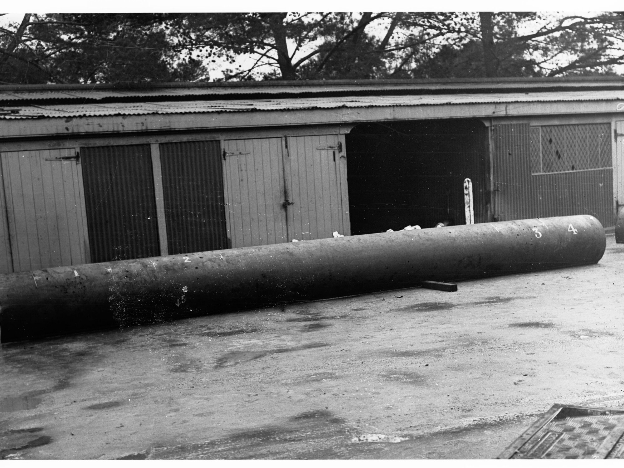 Steel Water Pipe in Front of Shed