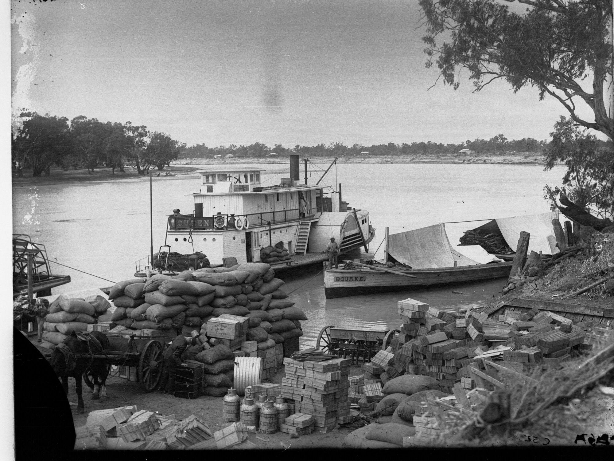Murray River Showing Paddlesteamer and goods on dock