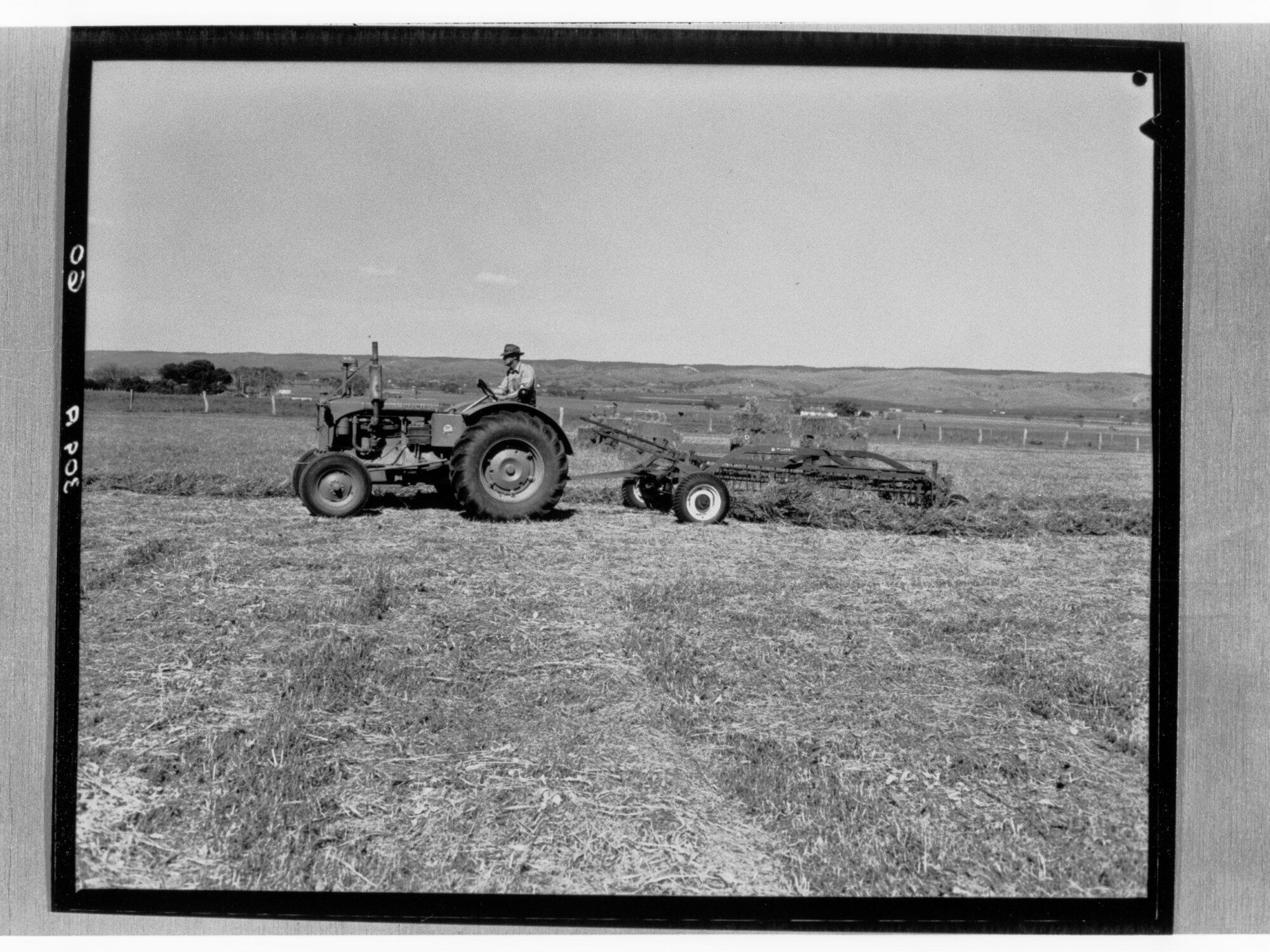 Man on tractor ploughing field