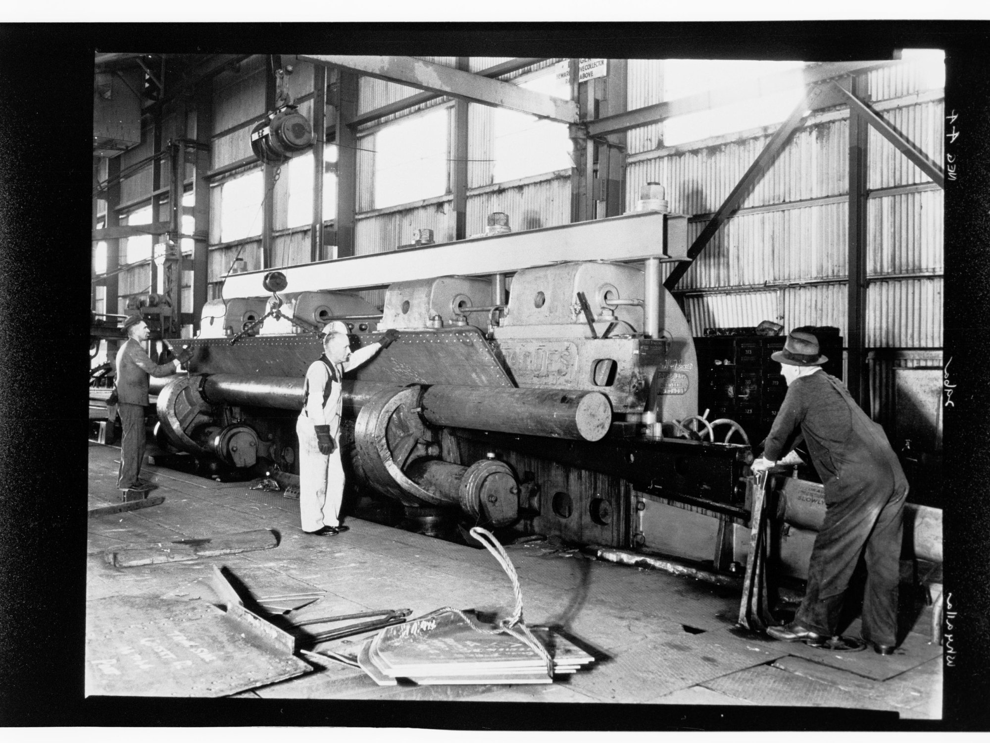 Whyalla - three men using industrial equipment