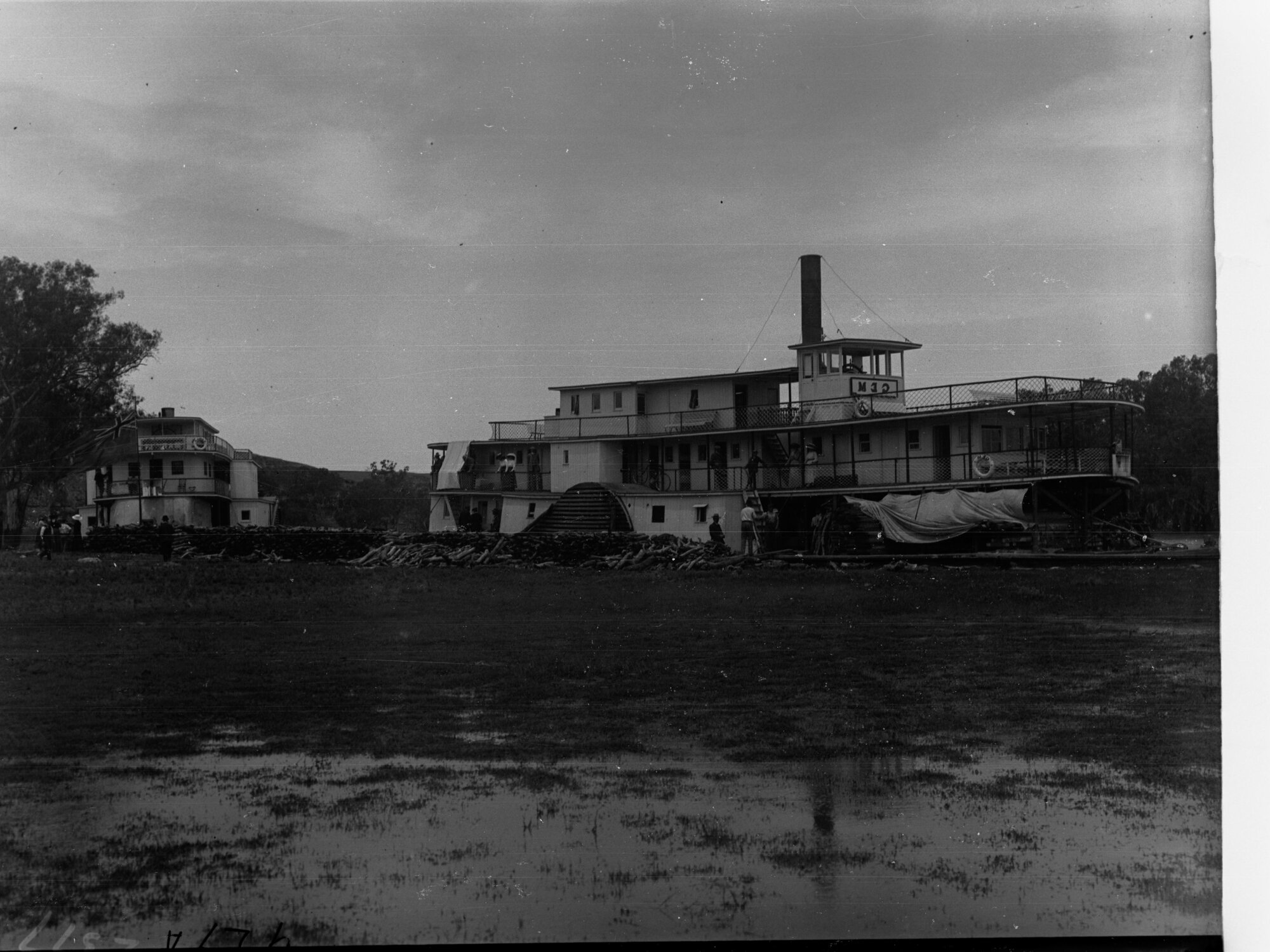 Two paddle steamers on a bank of River Murray