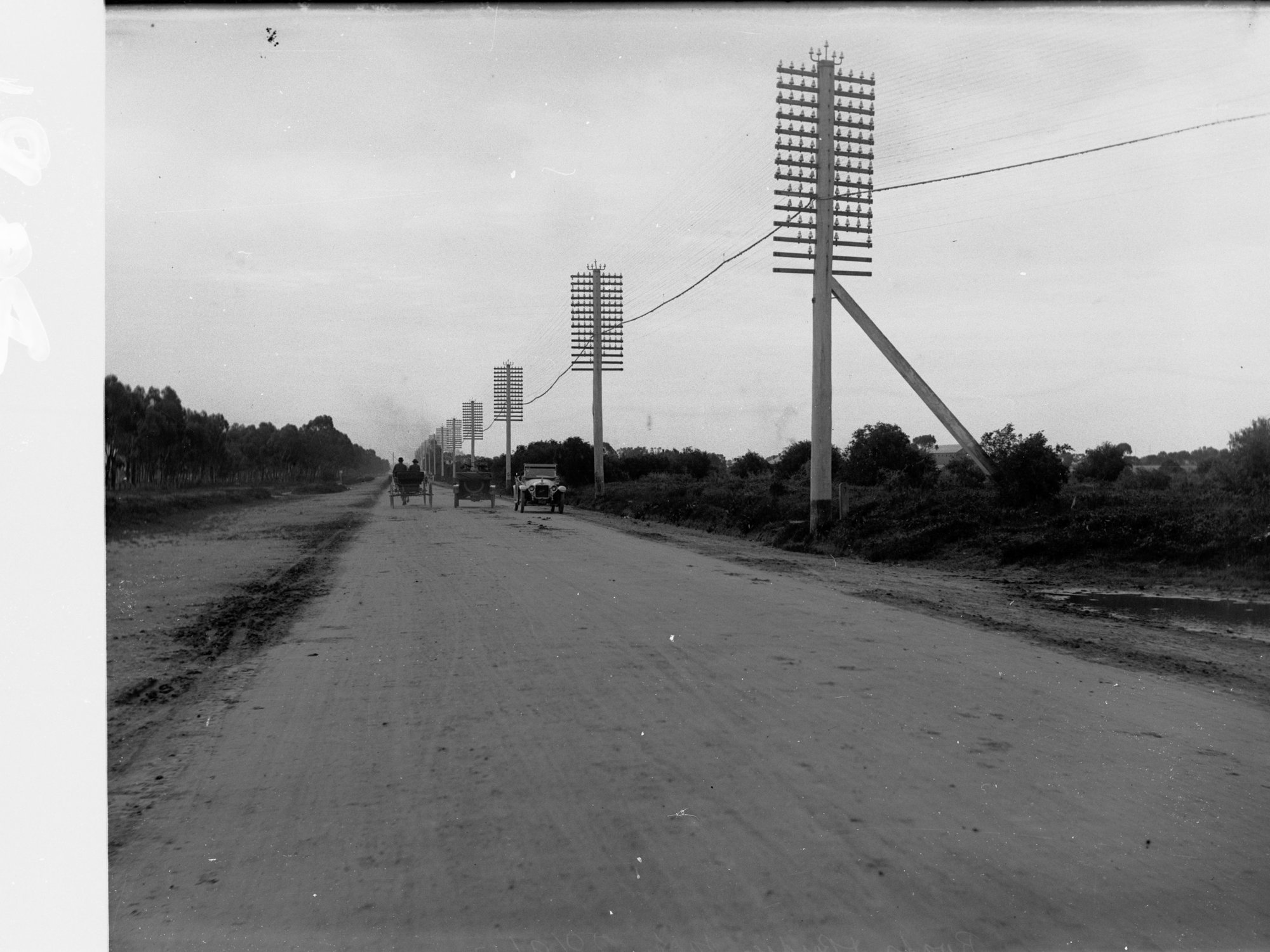 Port Adelaide Road with vehicles and telegraph poles
