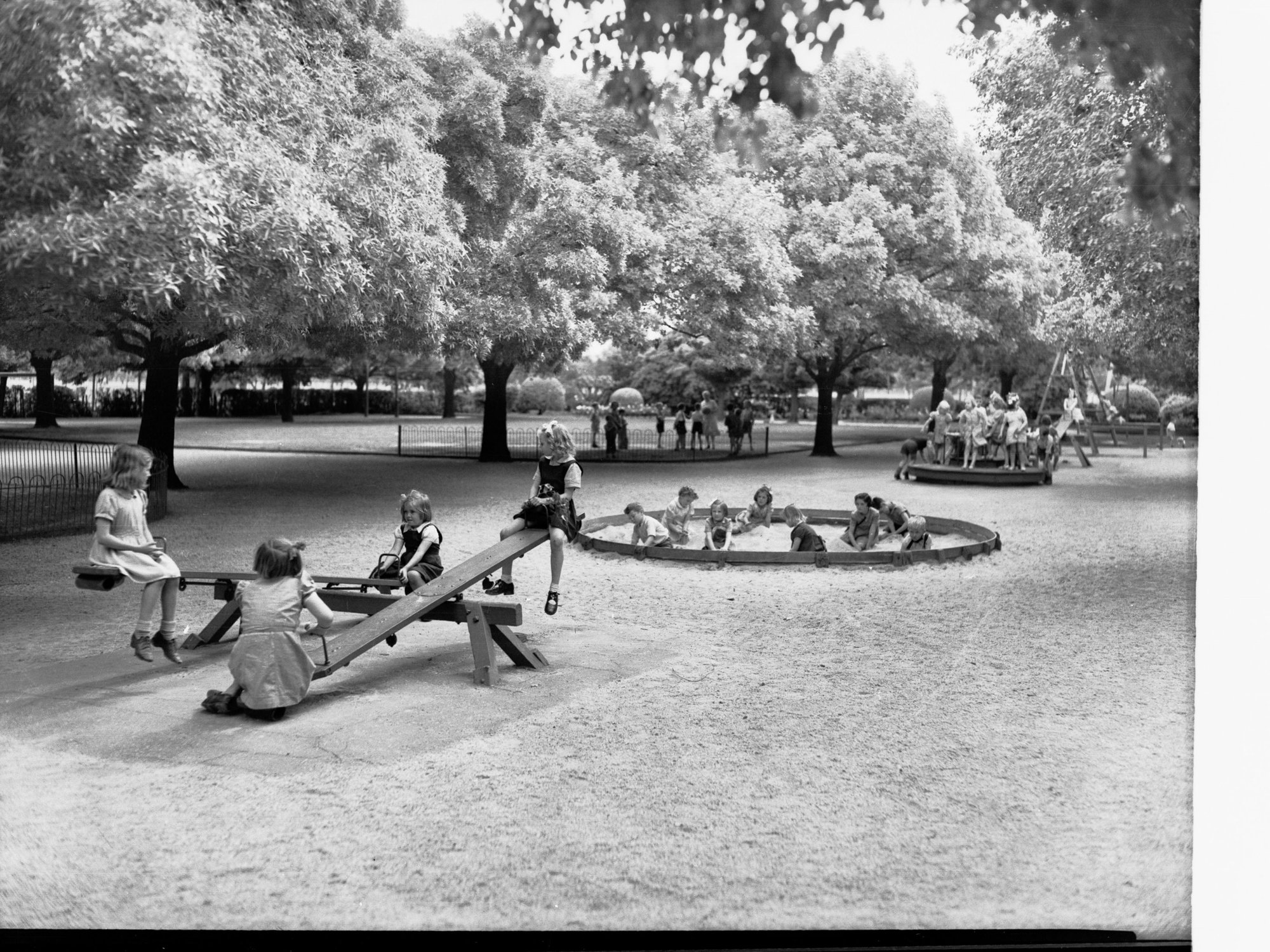 Children at Play in South Terrace Park on See Saw and in Sand Pit