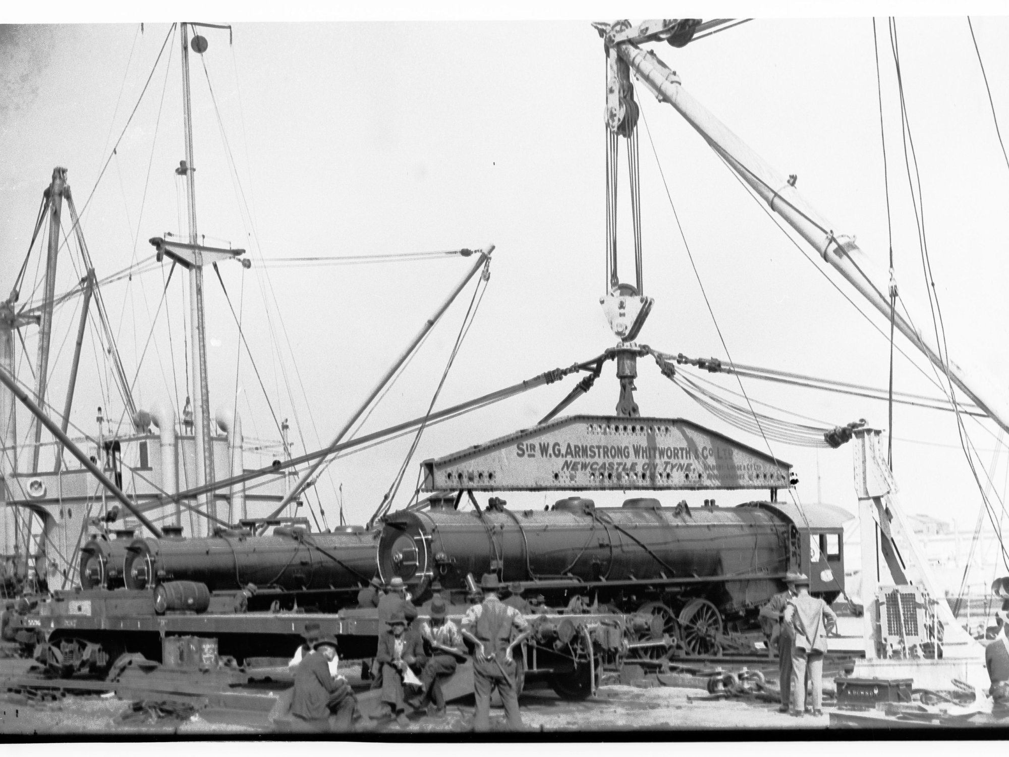 Unloading new railways engines from ship SS Beldis (SAR 600 Class Locomotive)