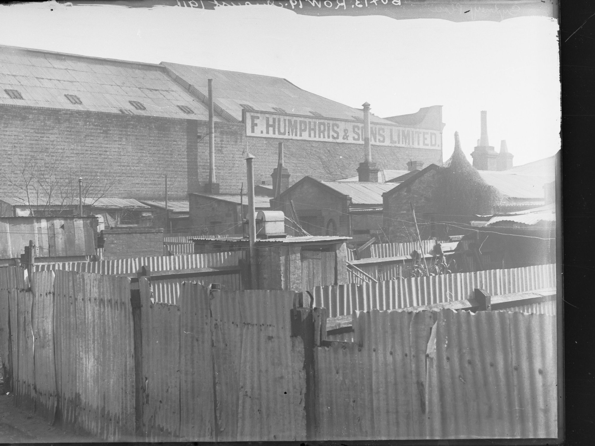 Backyards of houses in Sydney Place. The houses faced Carrington Street.|Factory owned by F Humphris &amp; Sons Ltd., Carrington Street.